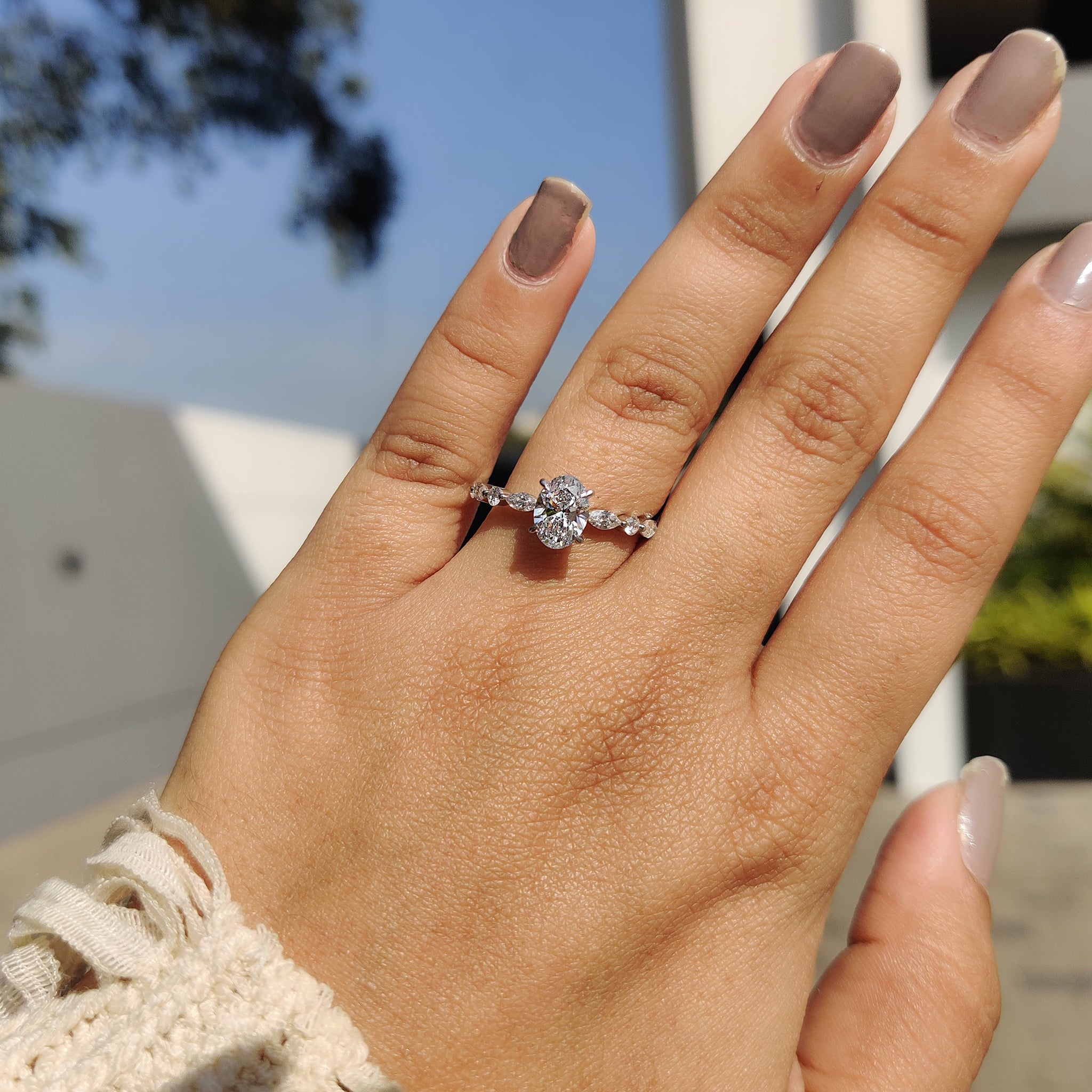 Round and marquise side stone engagement ring.