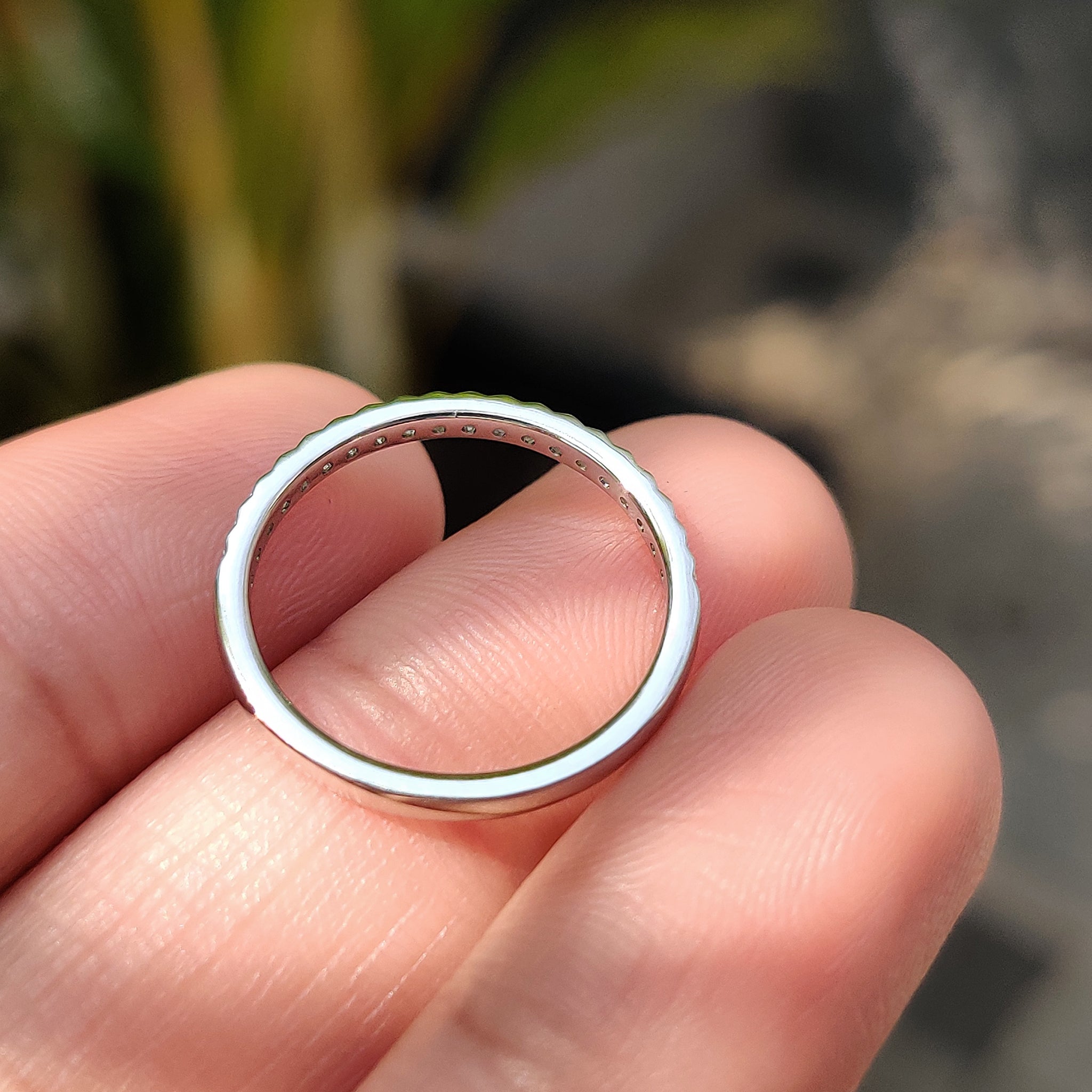 Lab grown diamond ring set in a white gold band.
