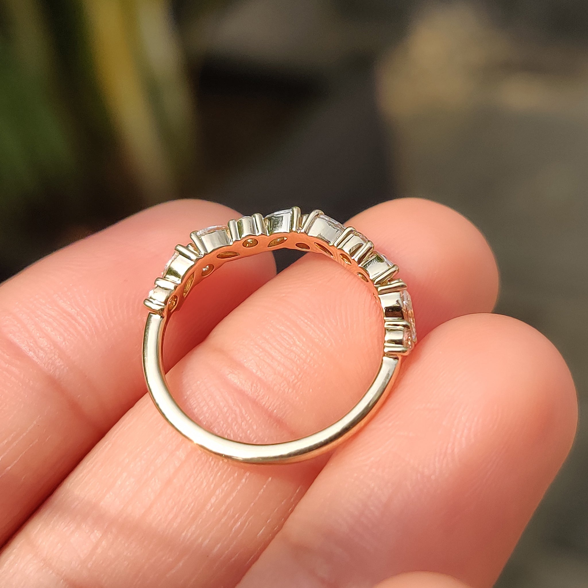 Carat Diamonds band with shared prong marquise diamonds.
