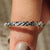 Round wedding band made with black moissanite.
