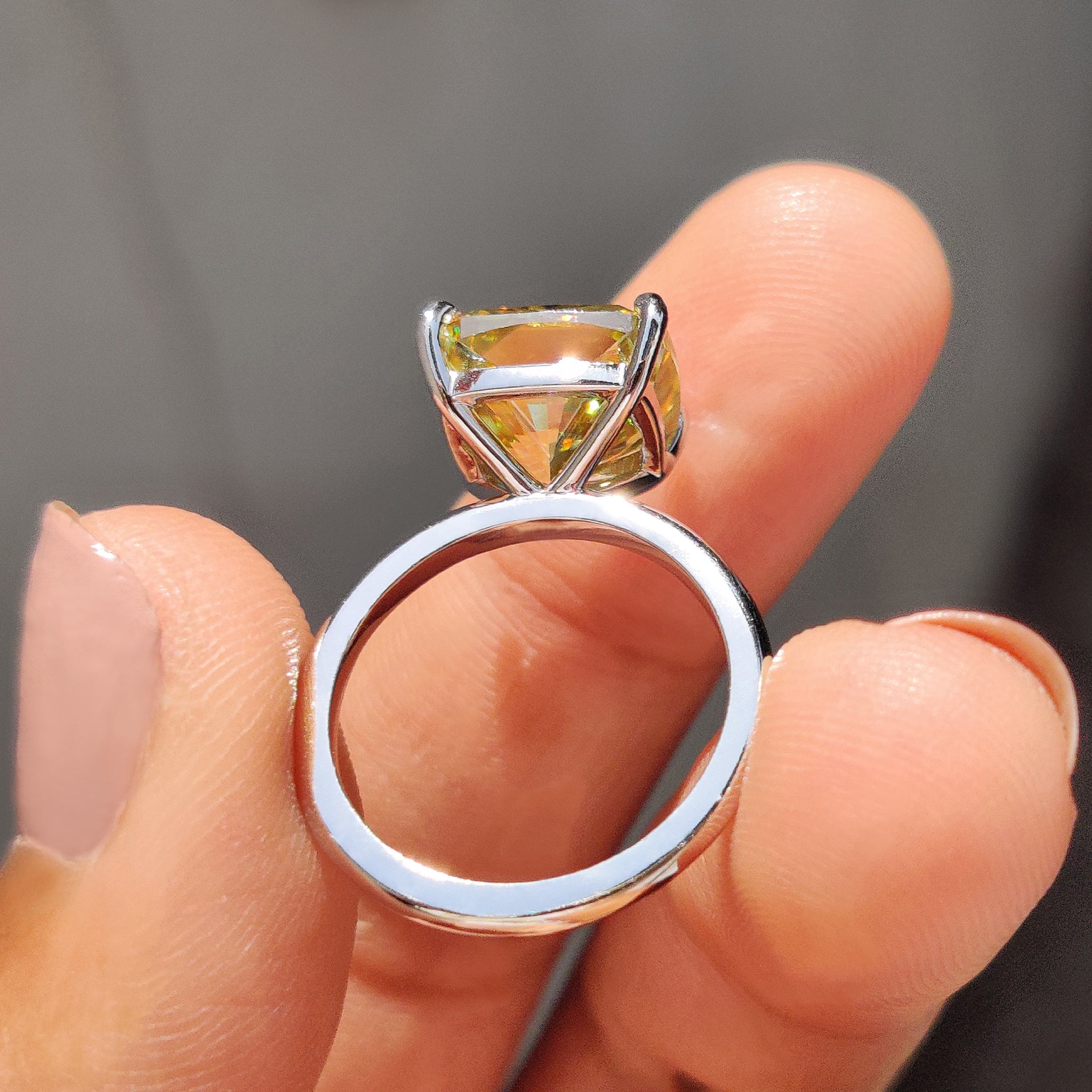 4 round prong setting cushion cut solitaire ring that captures attention.