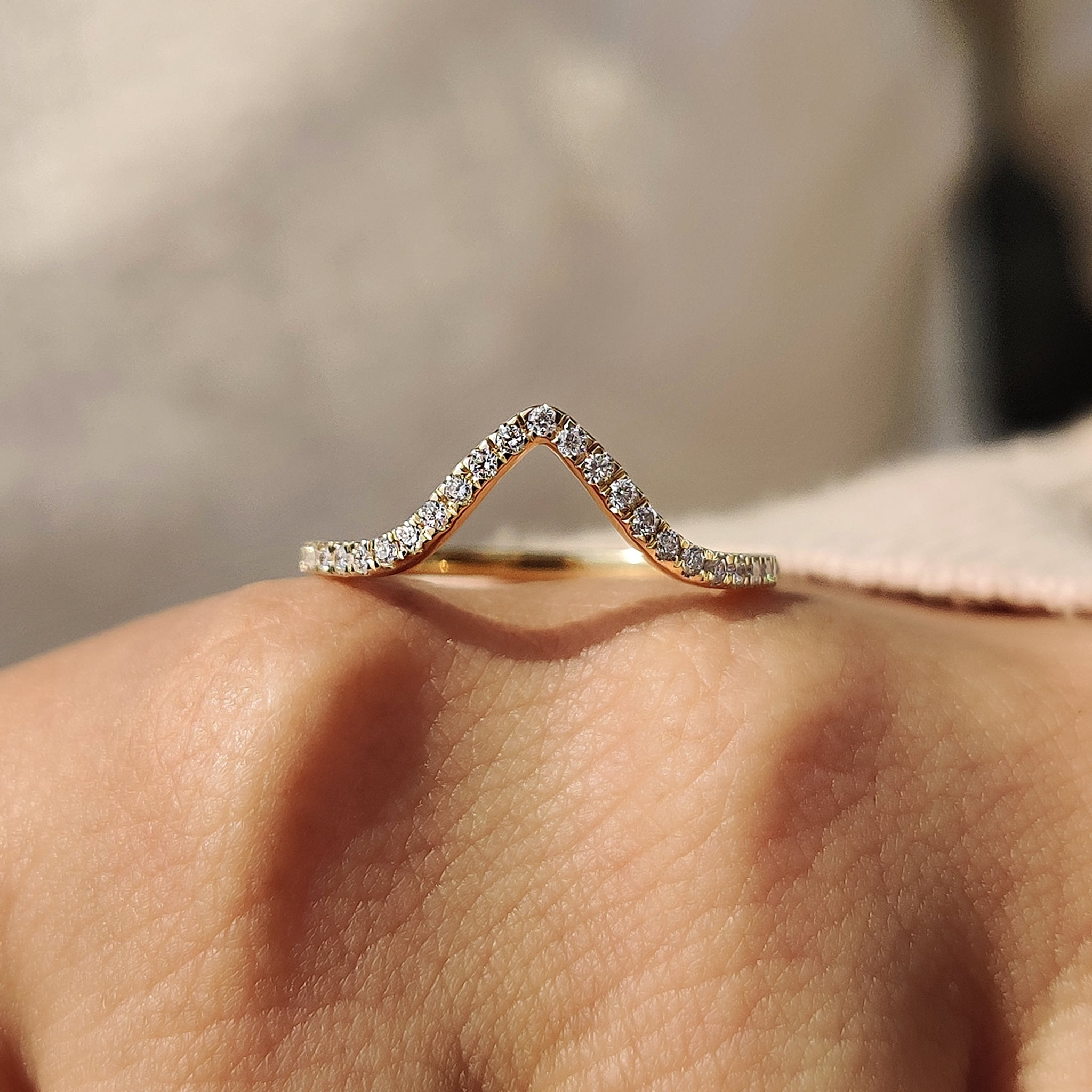 A diamond chevron ring featuring exquisite craftsmanship and brilliance.
