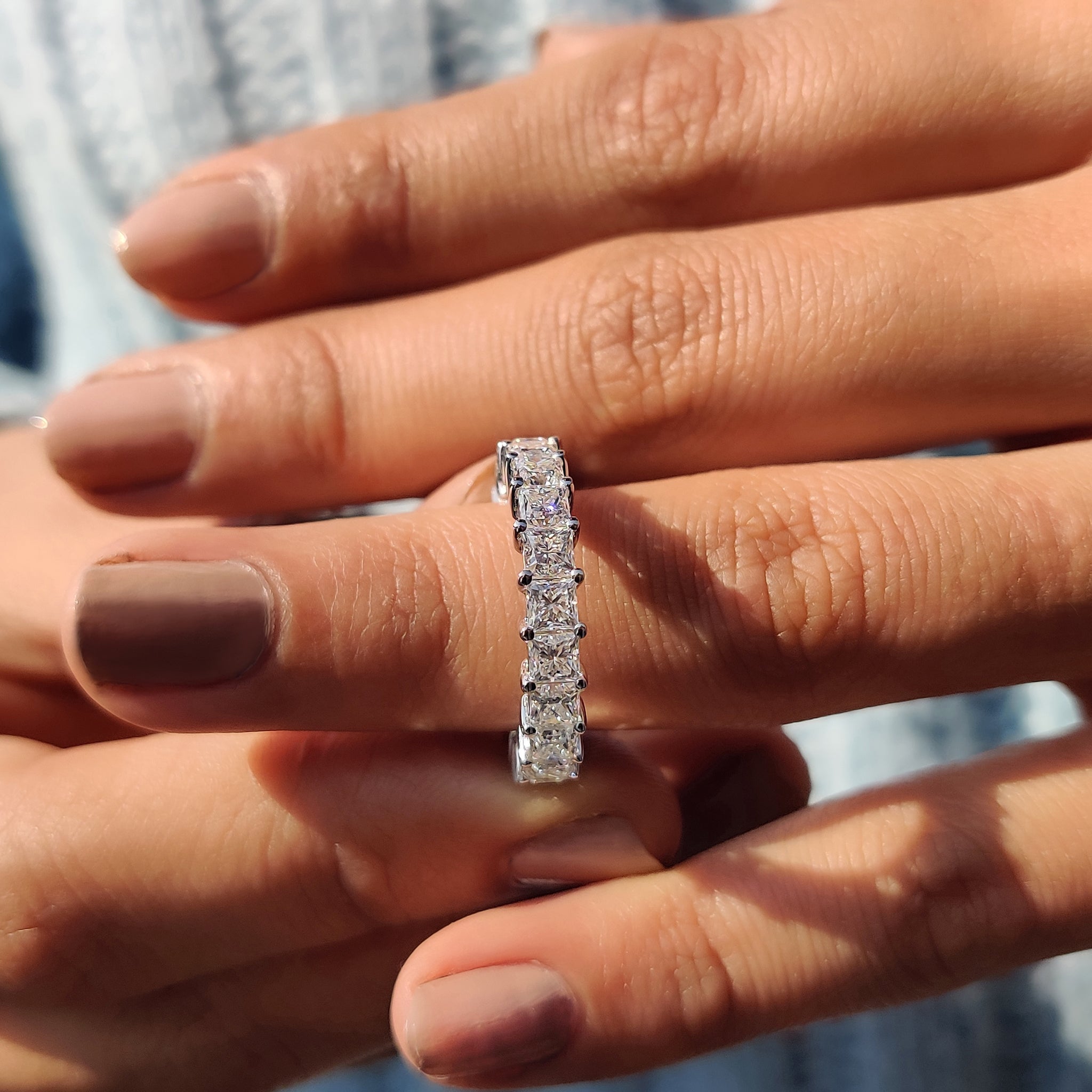 Anniversary gift for her featuring a handmade princess cut moissanite eternity ring.