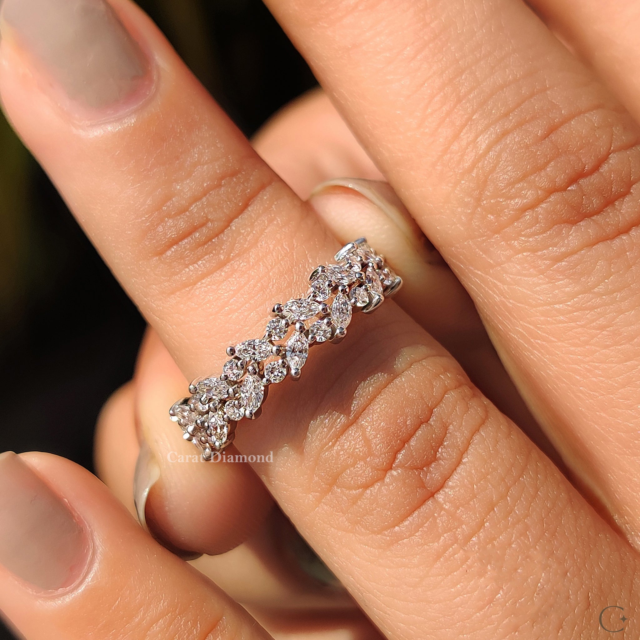Handmade band featuring marquise and round stones.