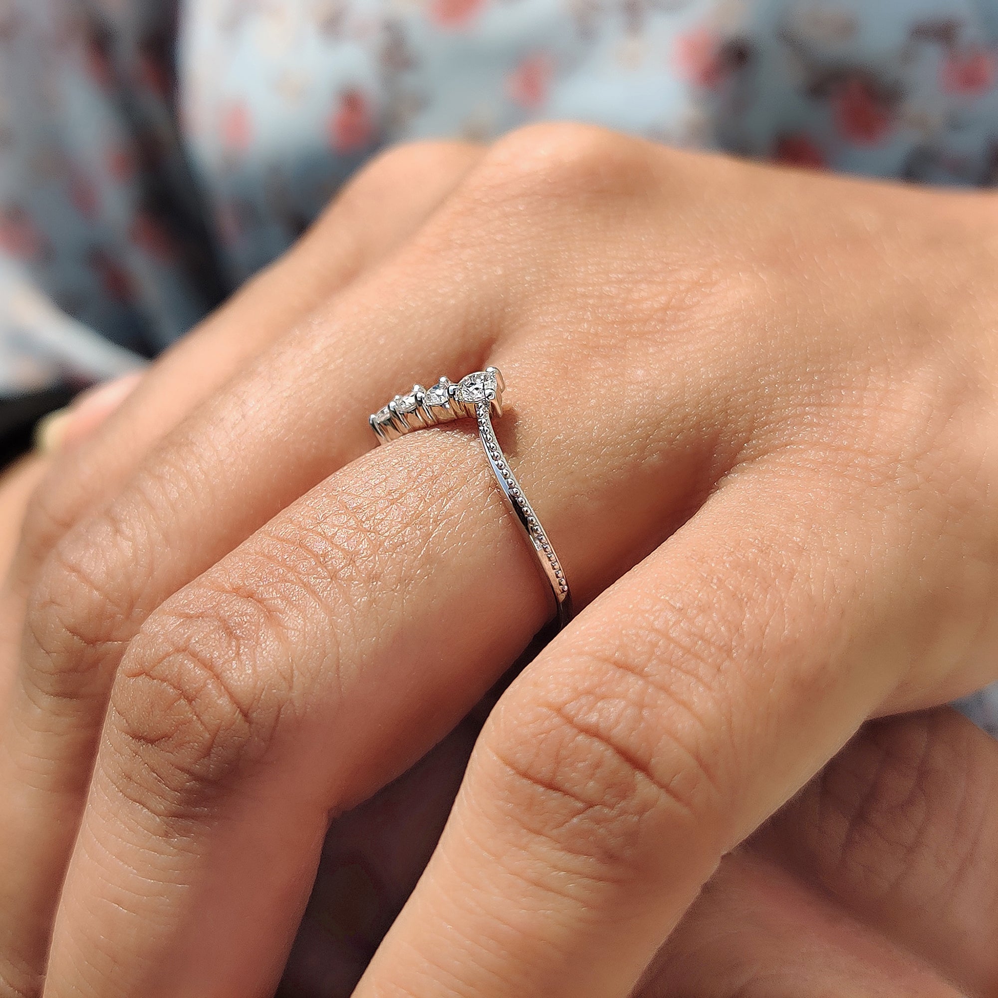 V shaped band with chevron styling in white gold.