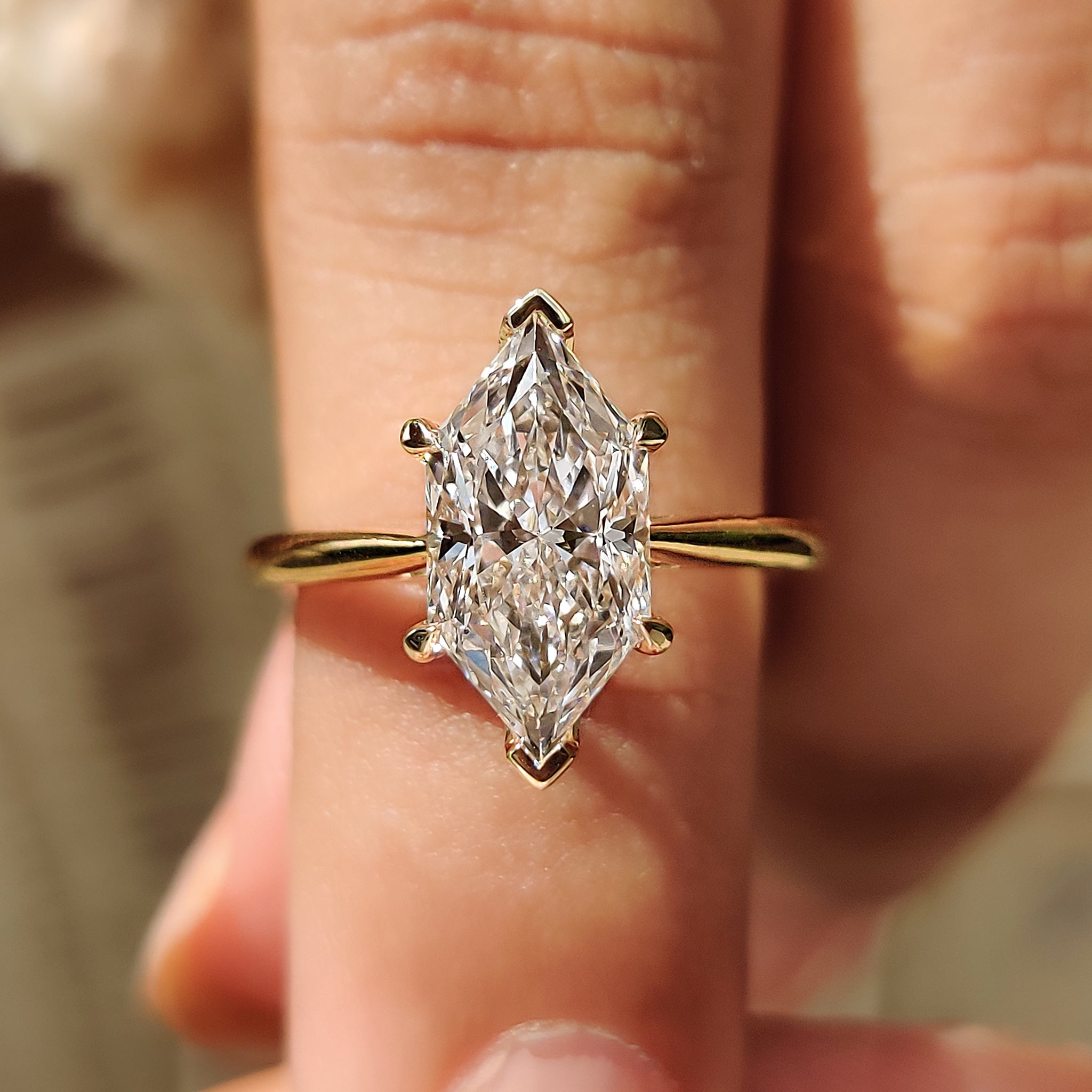 Hidden halo diamond ring with Dutch marquise engagement ring.