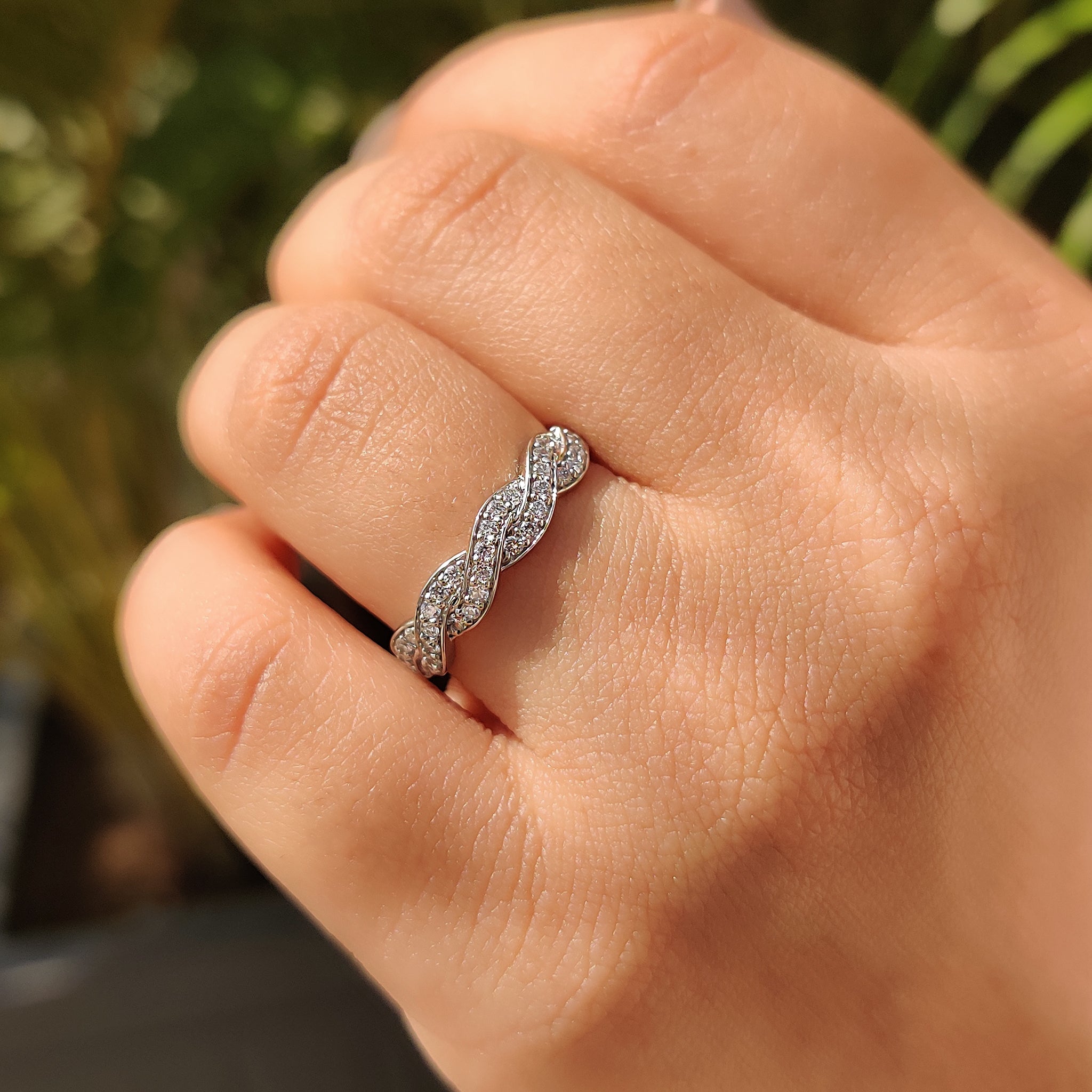 Carat Diamonds band with prong set round stones.

