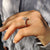 White gold engagement ring featuring a brilliant diamond.
