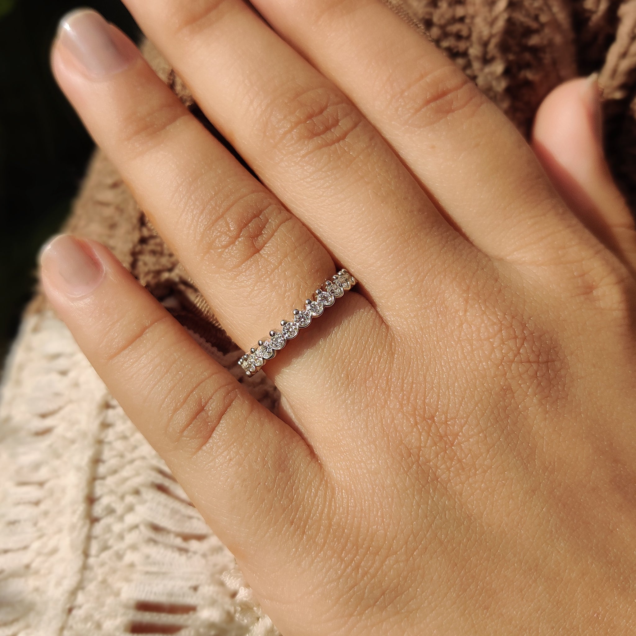 Full eternity lab grown diamond band in a prong setting.

