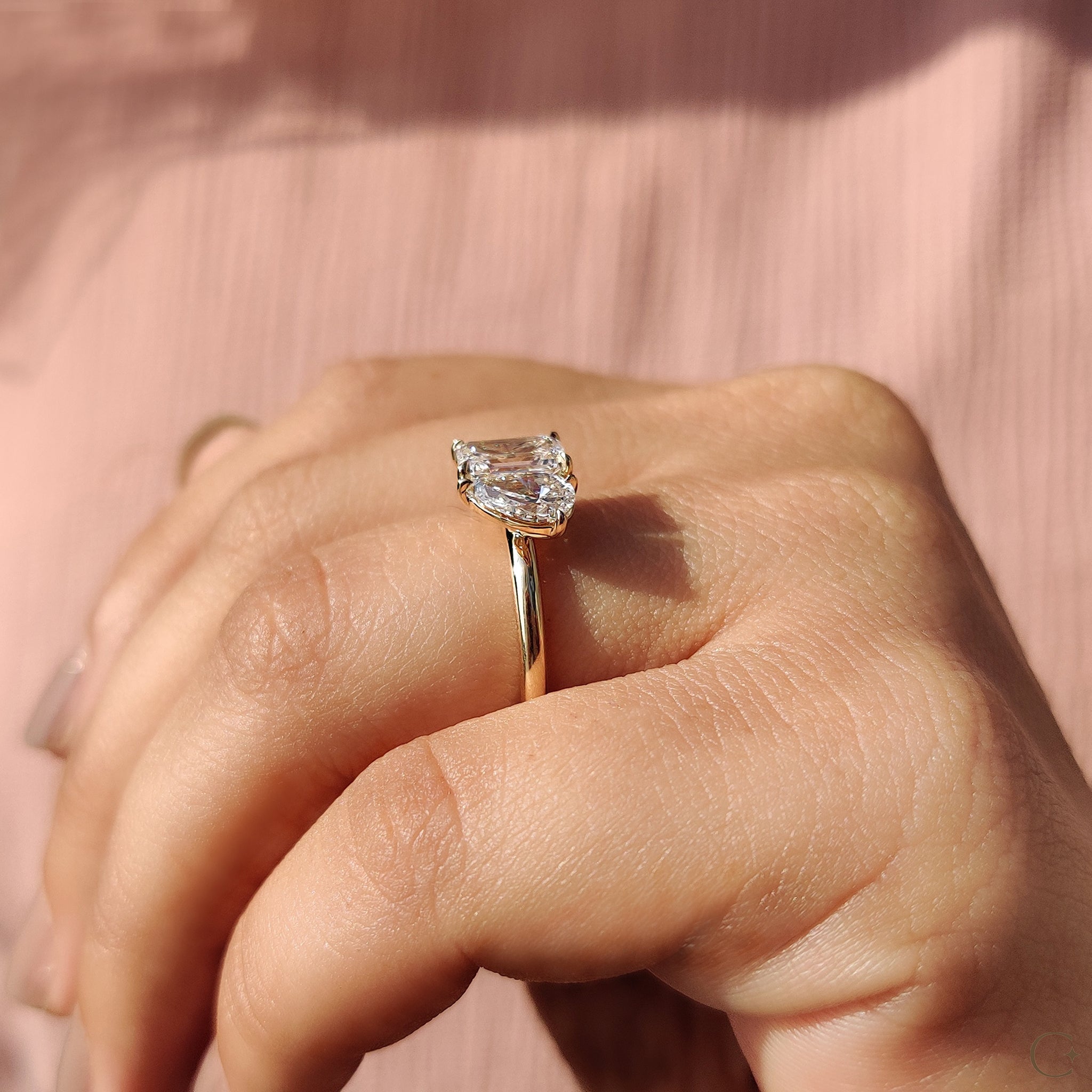 Emerald cut diamond ring set in a classic yellow gold band.

