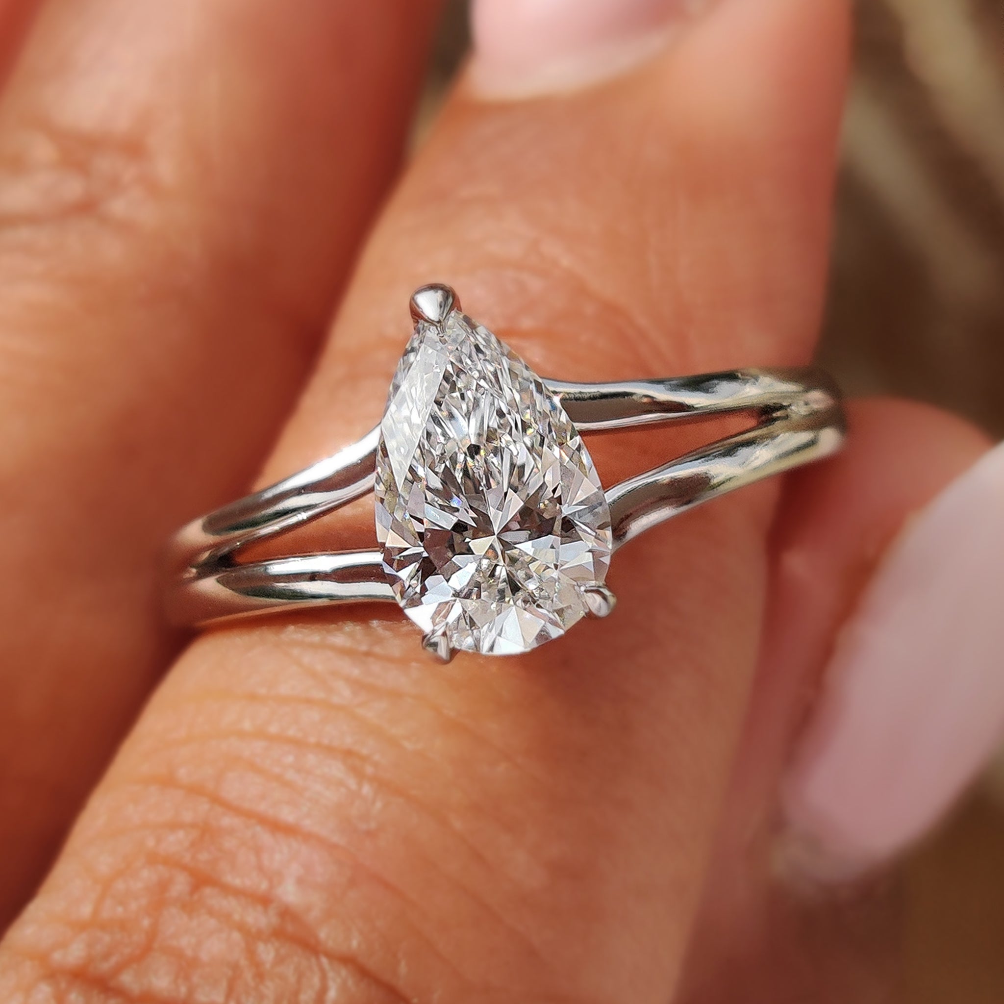 Pear shape diamond ring with brilliant sparkle and classic elegance for a timeless statement.
