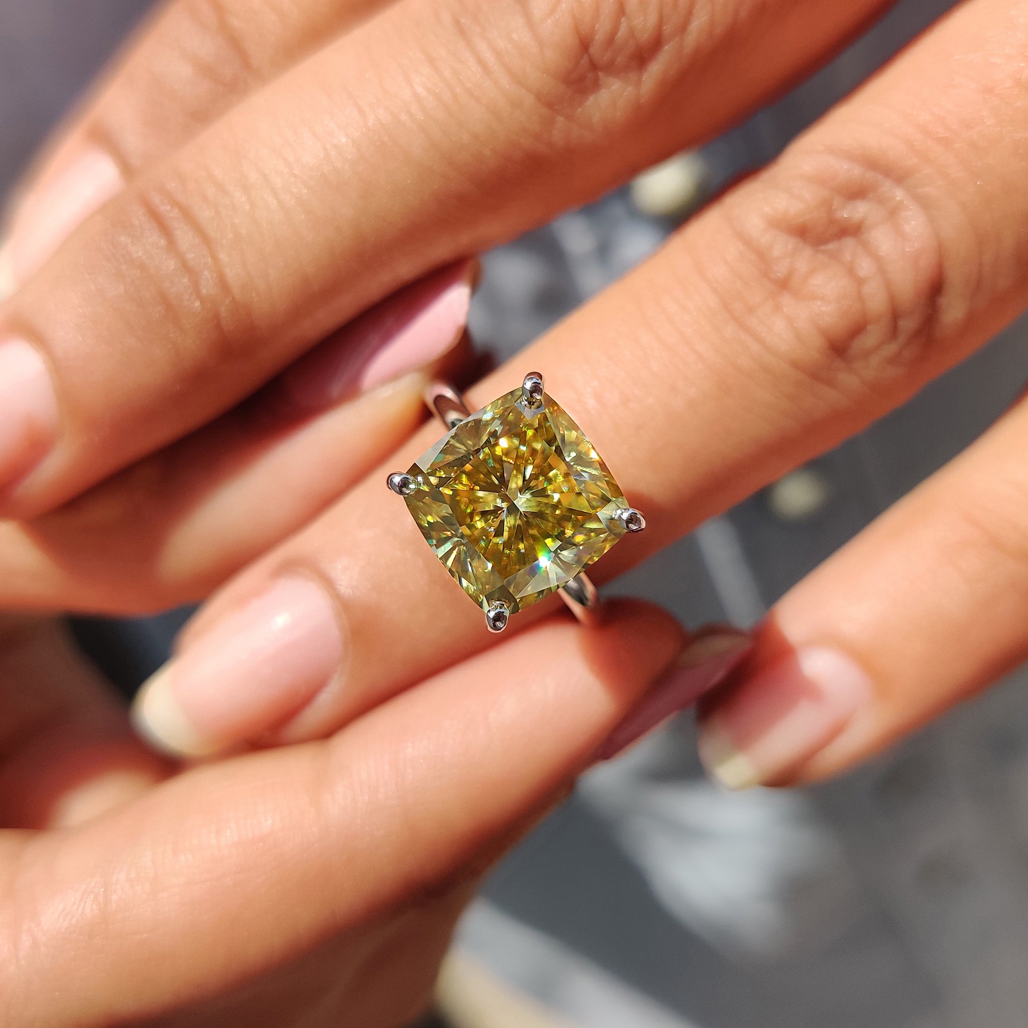 Moissanite engagement ring featuring a cushion cut design and premium quality.