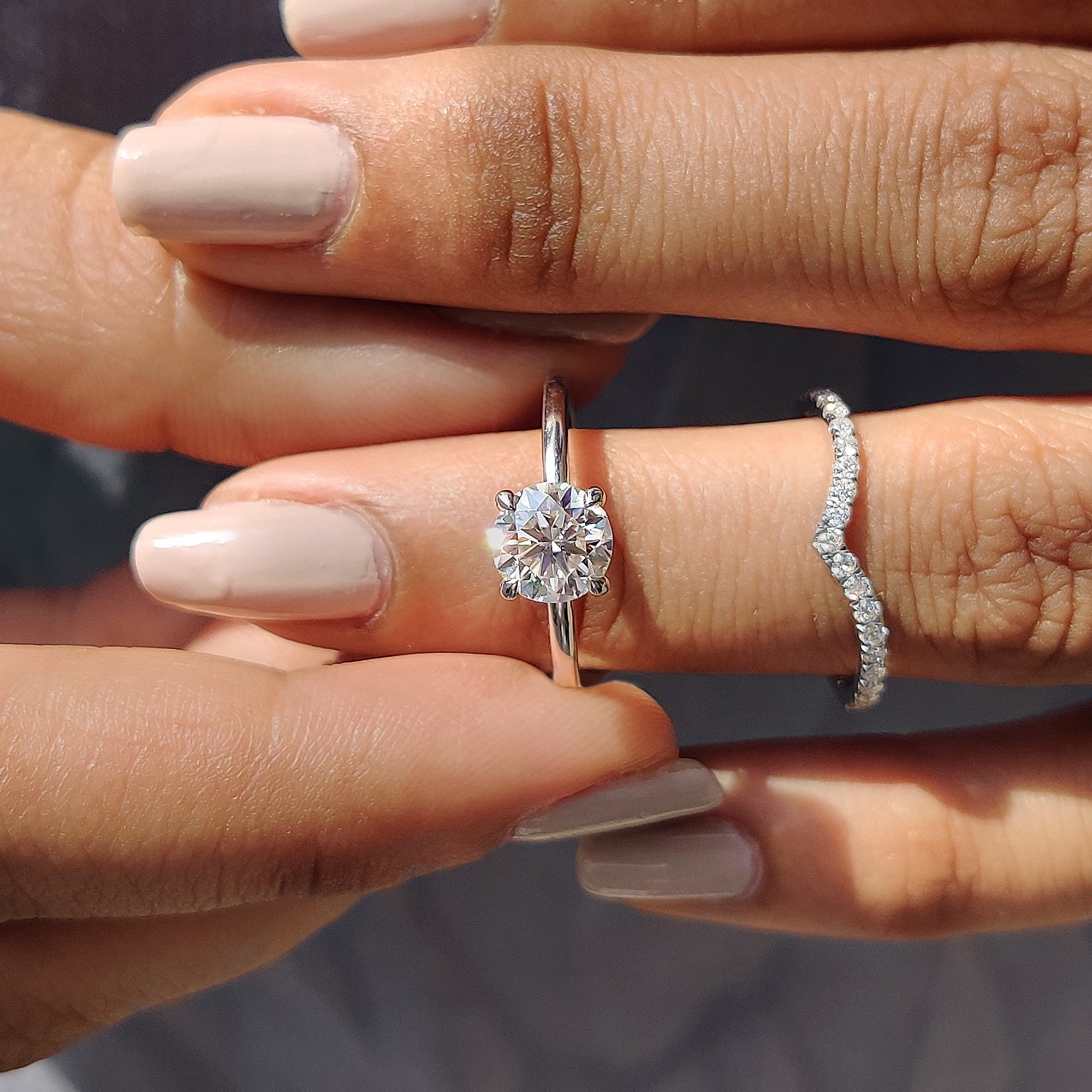 Half eternity wedding band in white gold designed to match a solitaire engagement ring.
