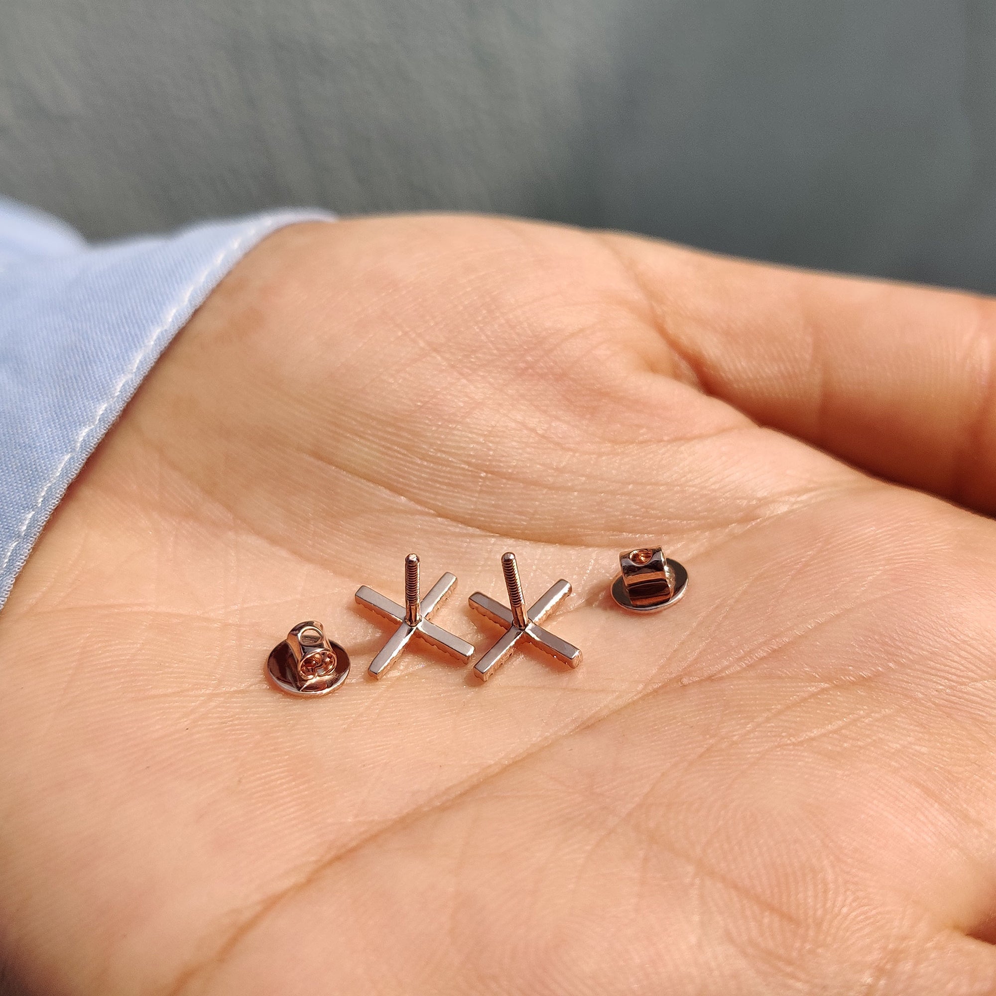 Round cut moissanite earrings created as X shaped earrings for earrings for women.
