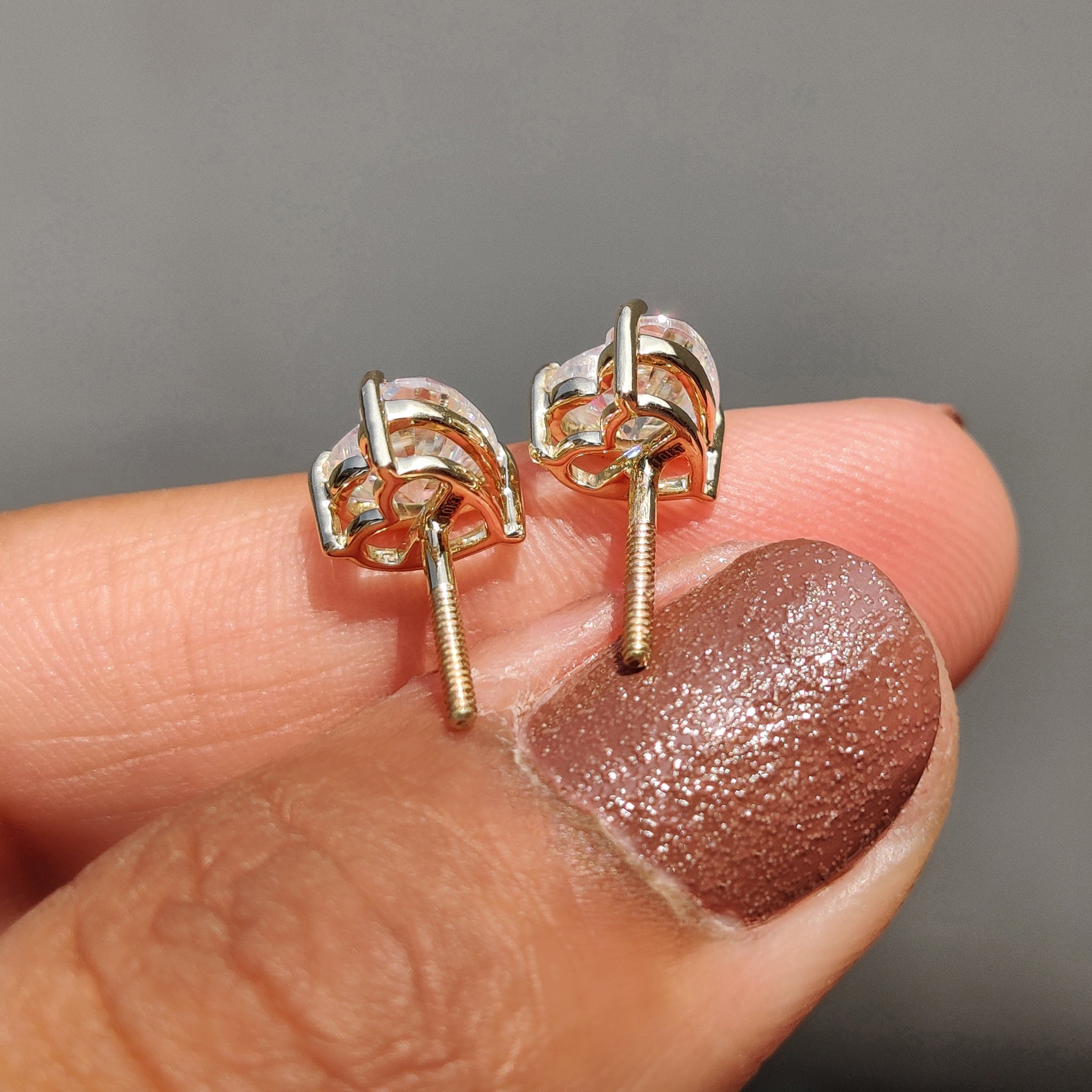 Earrings for women featuring Heart shaped Earrings in white gold stud earrings.
