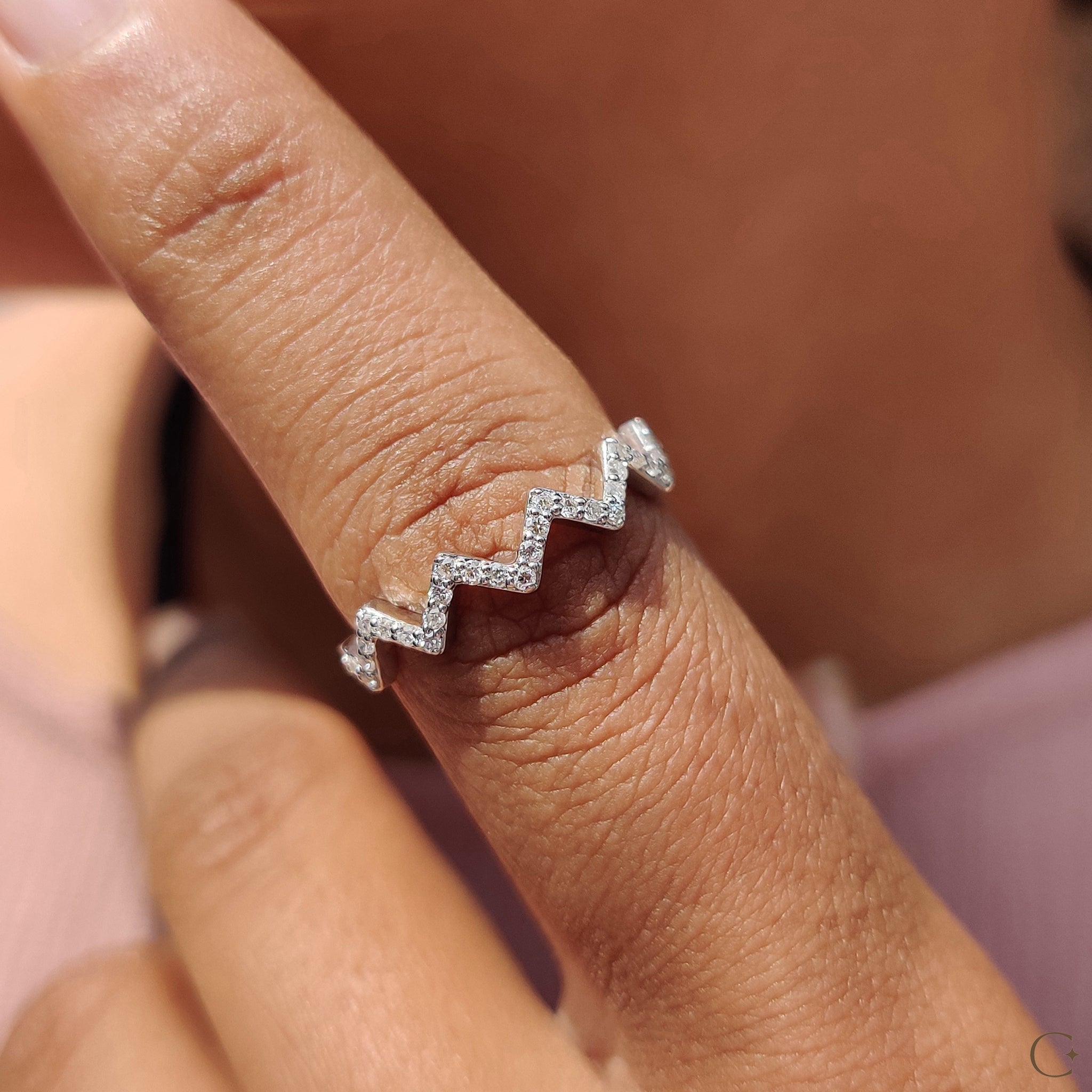 Handmade jewelry band with round cut diamonds.
