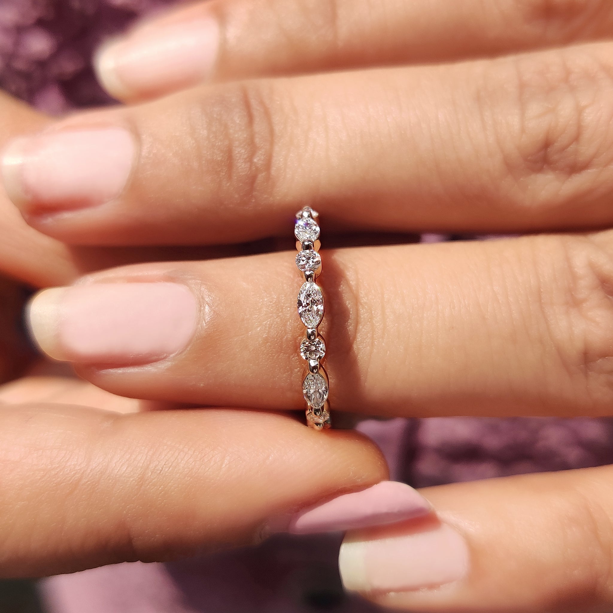 White gold diamond band with a sleek, modern design.
