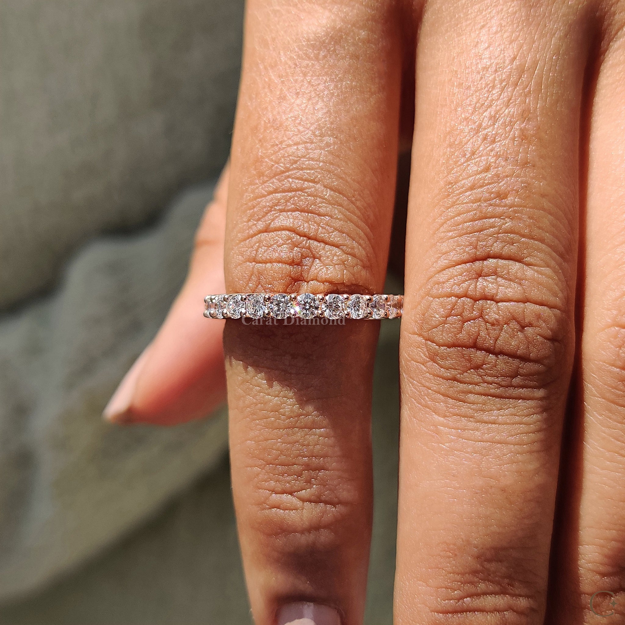 Carat diamonds wedding band glowing with brilliant sparkle in sunlight.