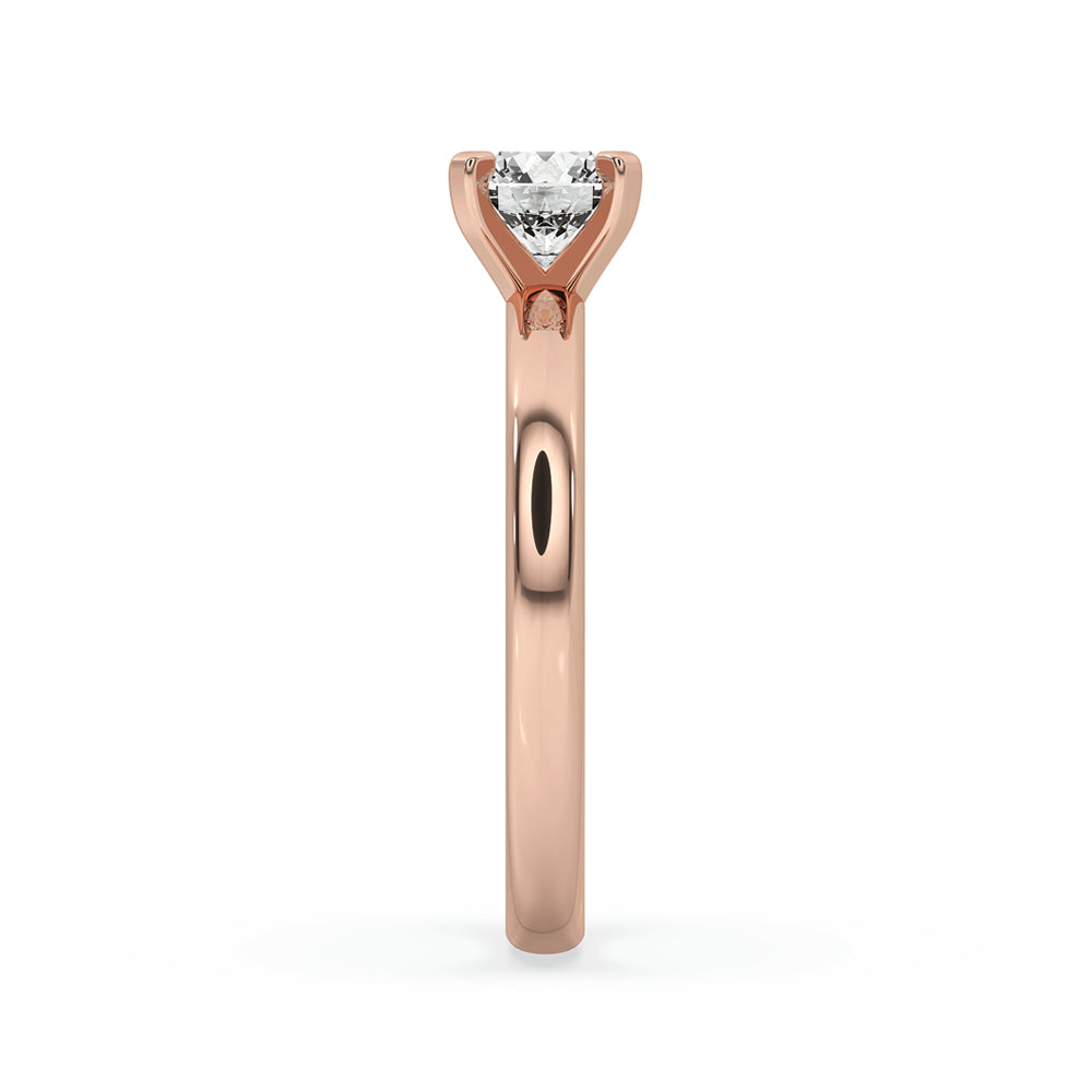 Solitaire diamond round ring with tab prongs and a handmade band for a minimal engagement ring.