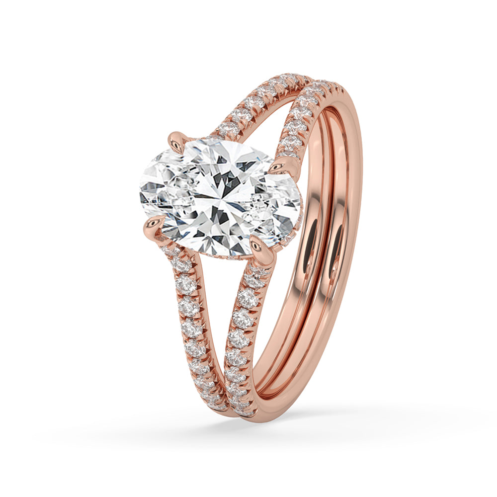 Oval shaped diamond ring with hidden halo setting, split shank diamond ring, and pave setting for classic beauty.