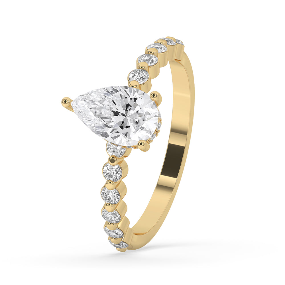 Pear shaped diamond ring in a prong setting with pave diamond accents, offering a modern and antique engagement ring design.
