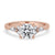 Round diamond with 4 round side stones in a classic 4 prong ring setting.