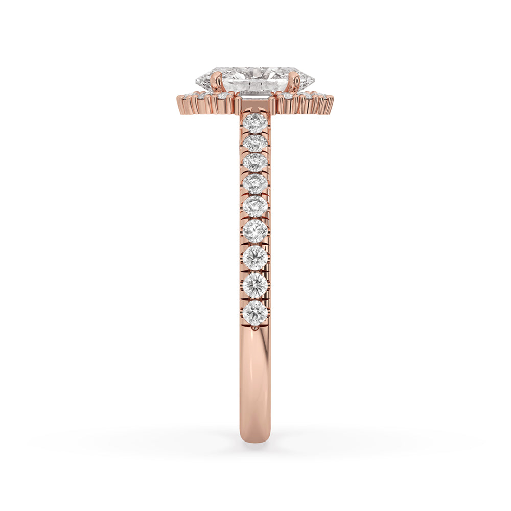 This oval halo diamond engagement ring is complemented by a luxurious pave band, adding a touch of sparkle and sophistication.
