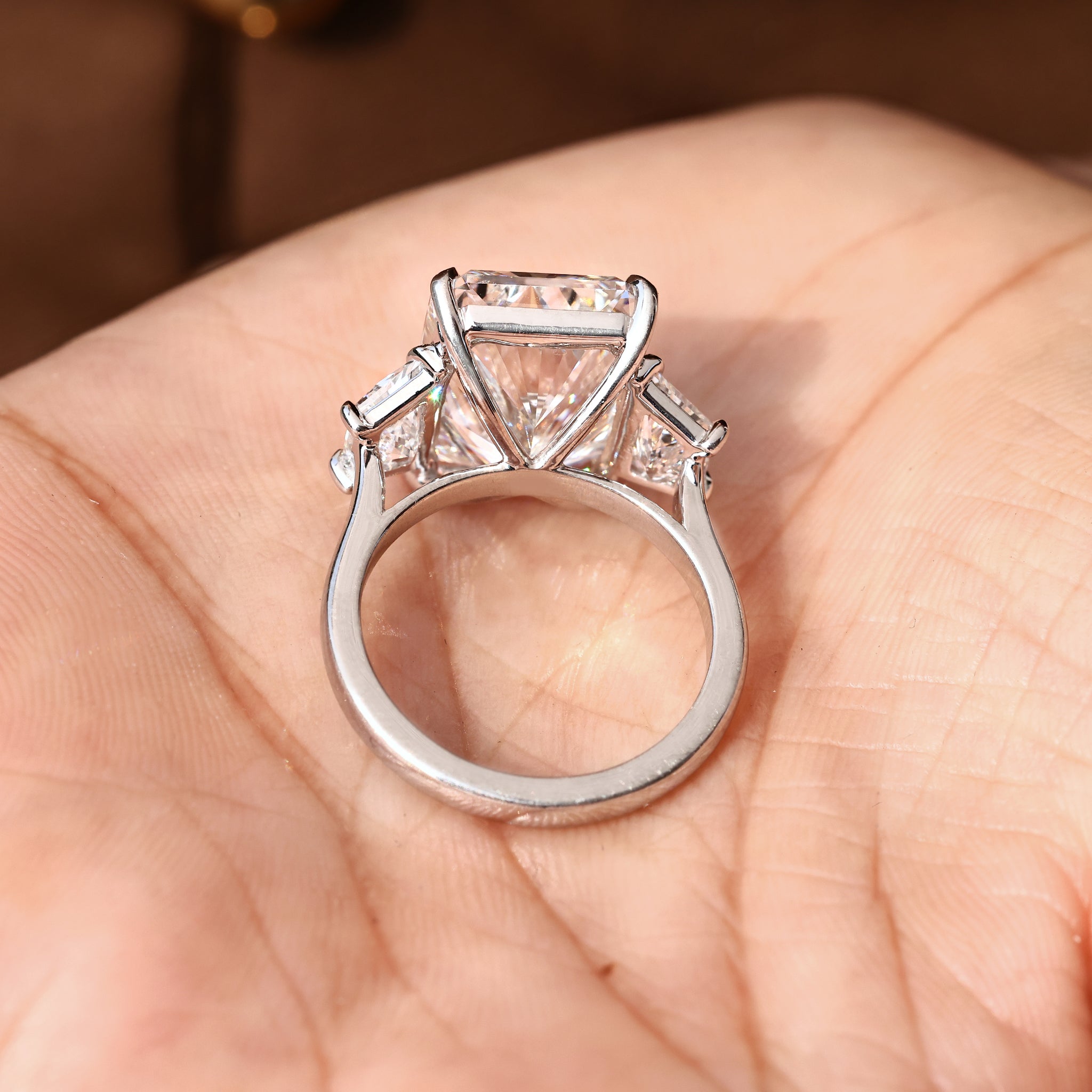 Lab grown radiant cut diamond ring with classic three stone setting.
