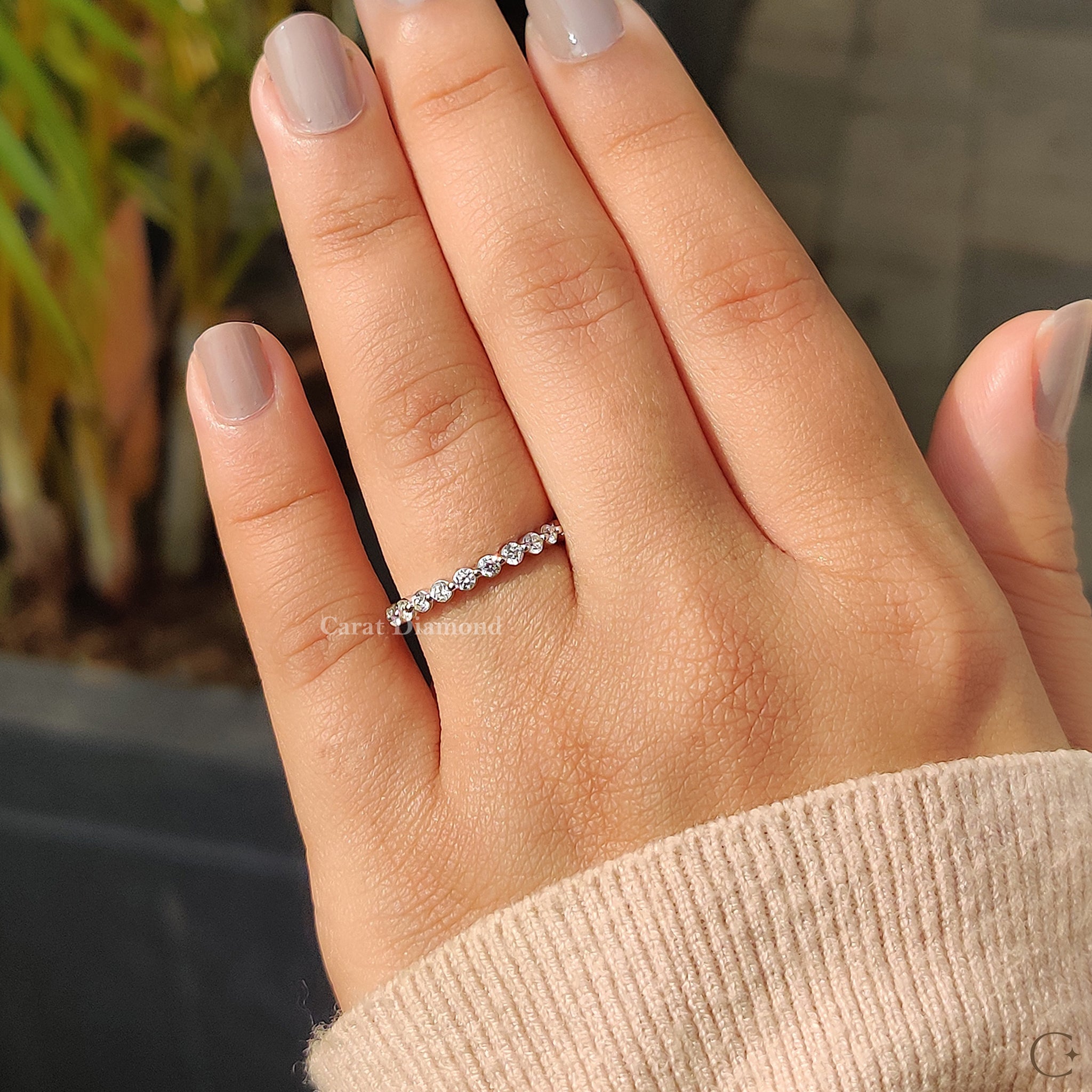Shared prong eternity band showcasing brilliant diamonds.
