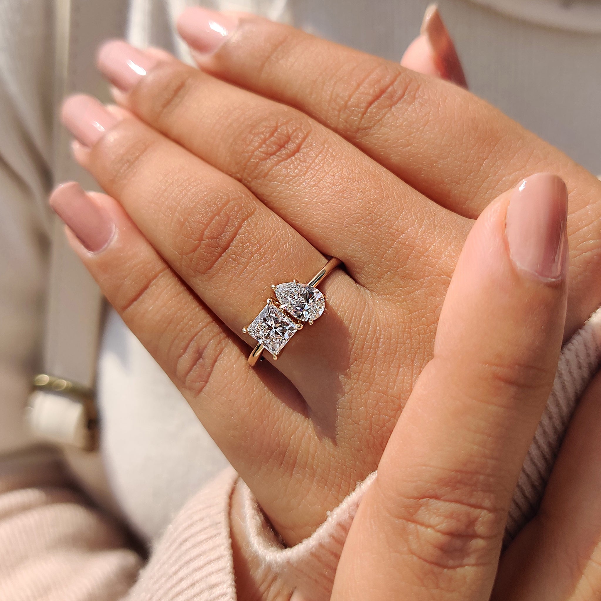 A handmade toi et moi ring crafted with lab-grown diamonds and set in a prong-style yellow gold band.

