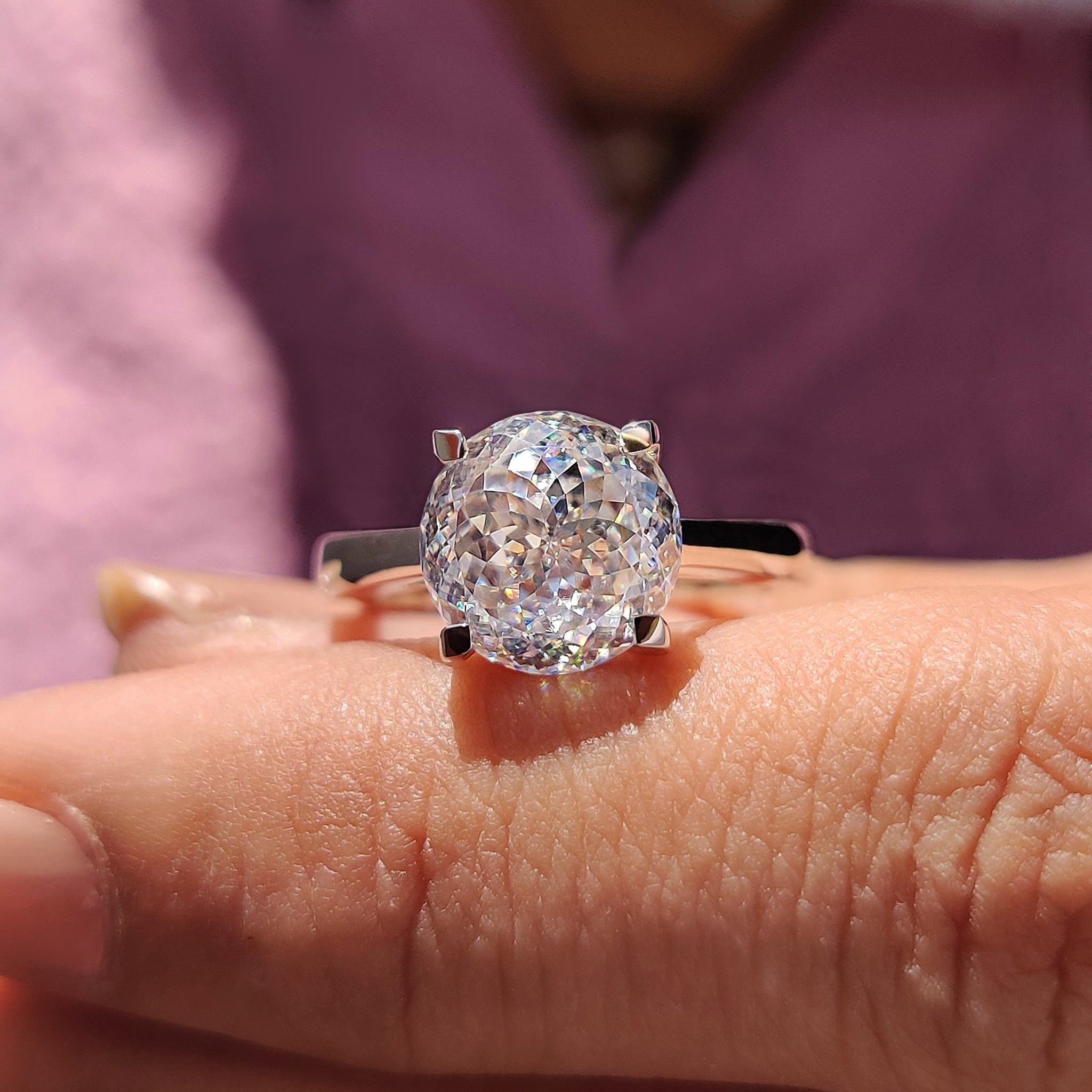 Trellis setting lifts gems high with pure smooth flow.