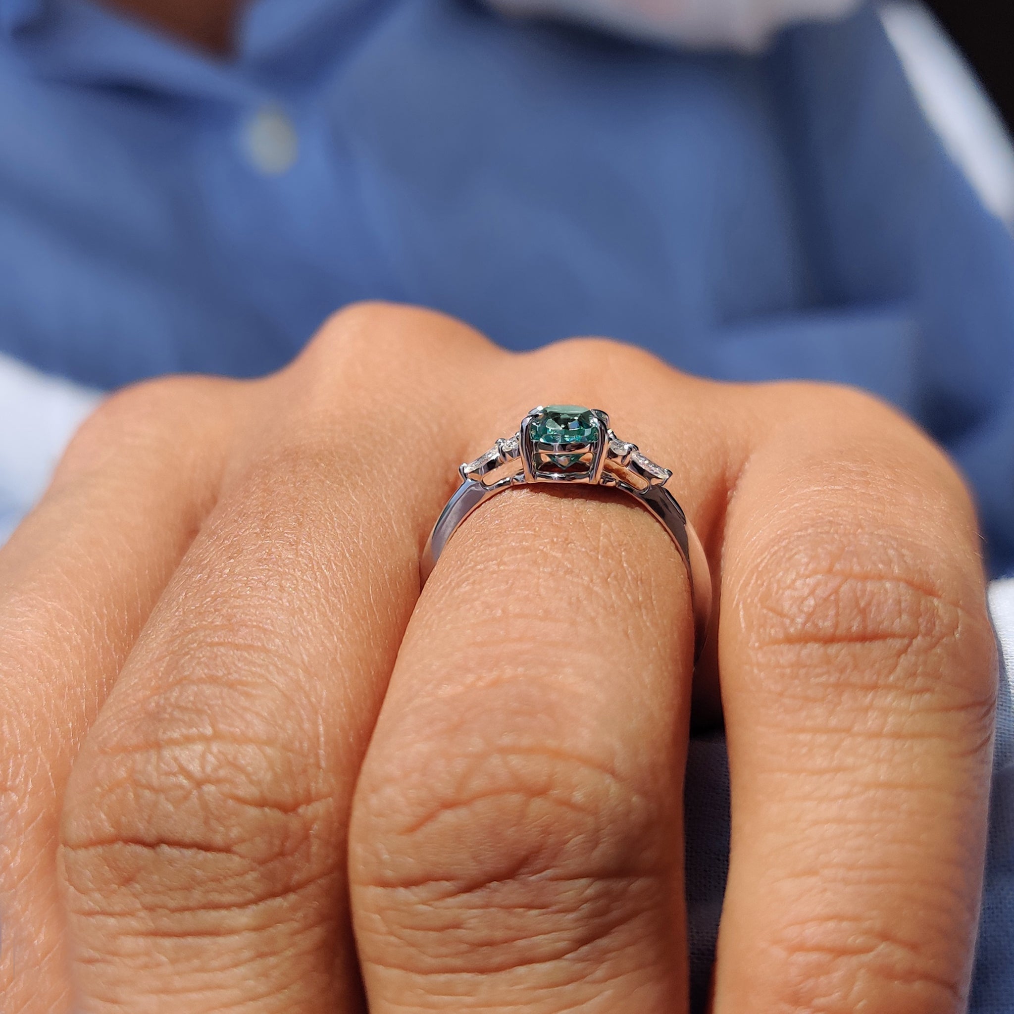 Marquise and round side stone ring created with a handmade jewelry approach.
