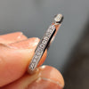 Wedding band stack option featuring a channel setting and round moissanite stones.