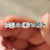 3/4 eternity band with round moissanite stones in a white gold setting.