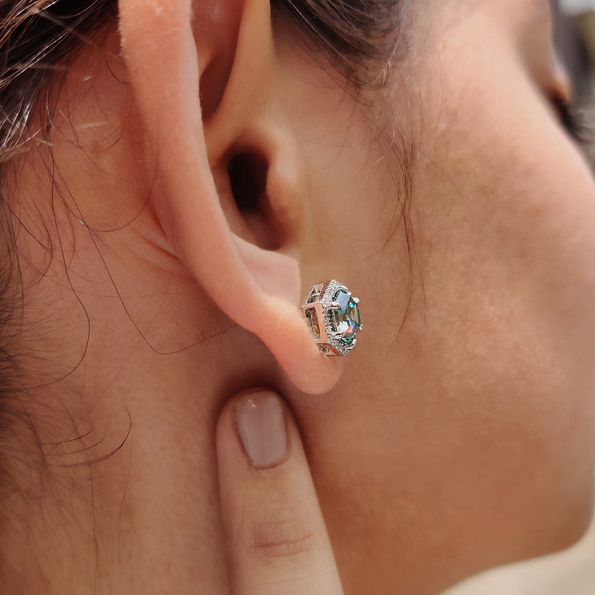 Halo earrings styled with Cyan Blue Moissanite and six claw prong setting.
