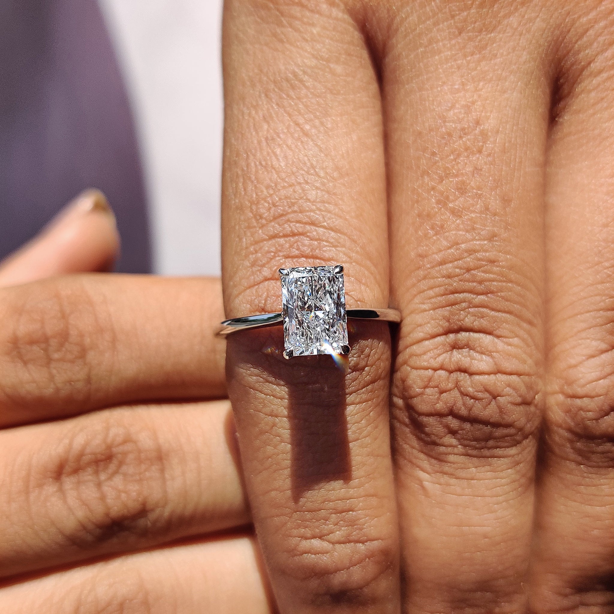 Cathedral setting ring featuring elevated diamonds.
