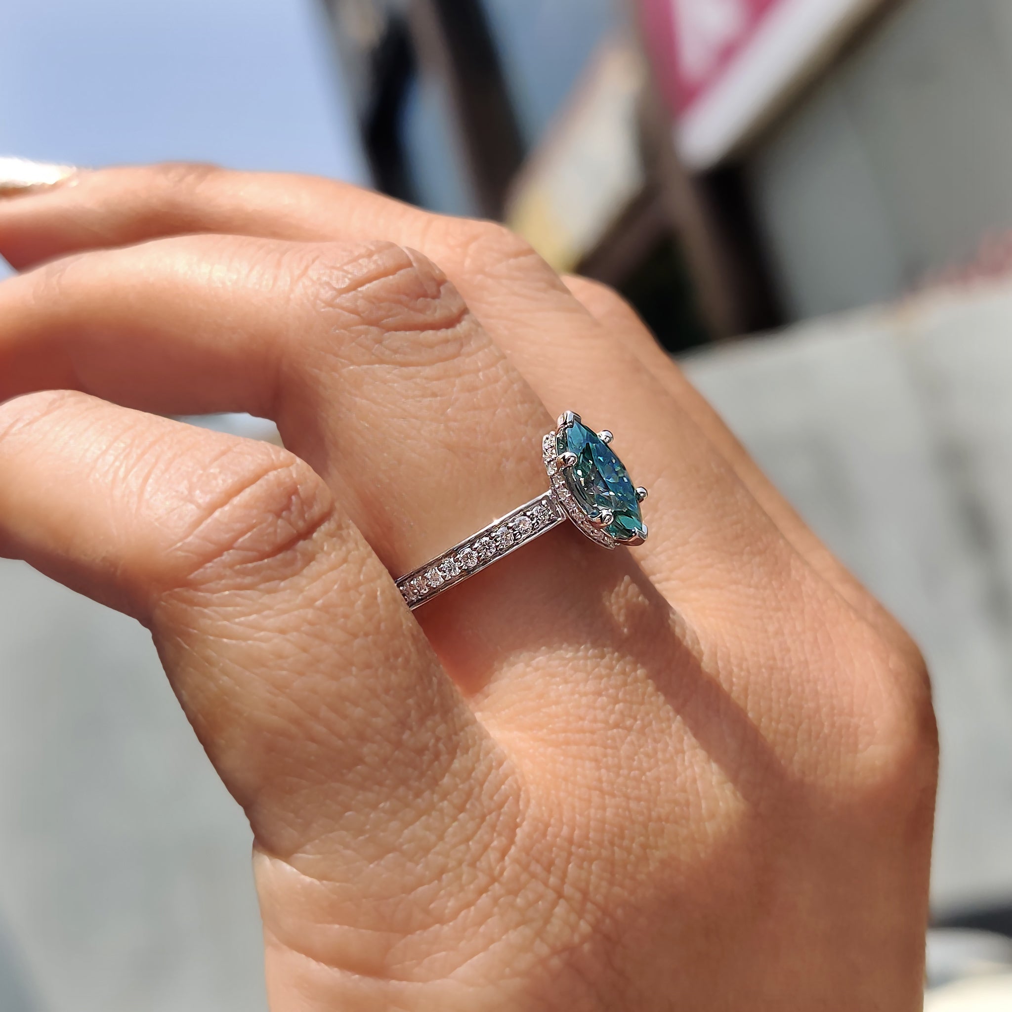 Custom engagement ring featuring marquise moissanite in white gold.