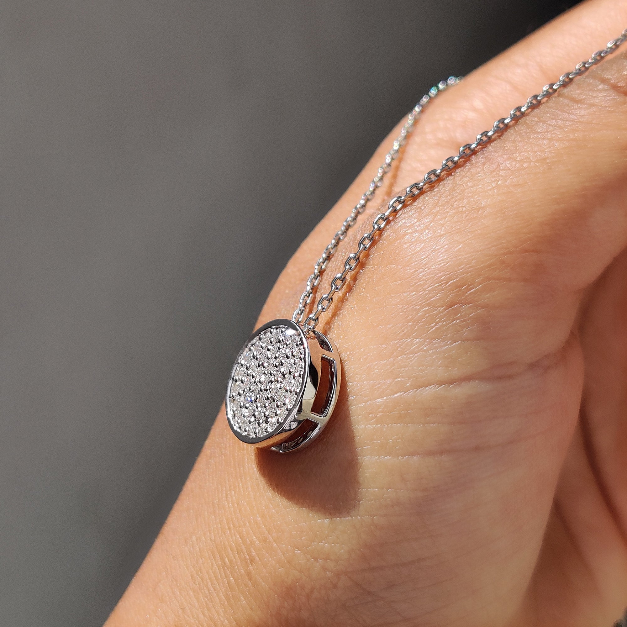 Lab grown diamond cluster pendant in white gold setting.
