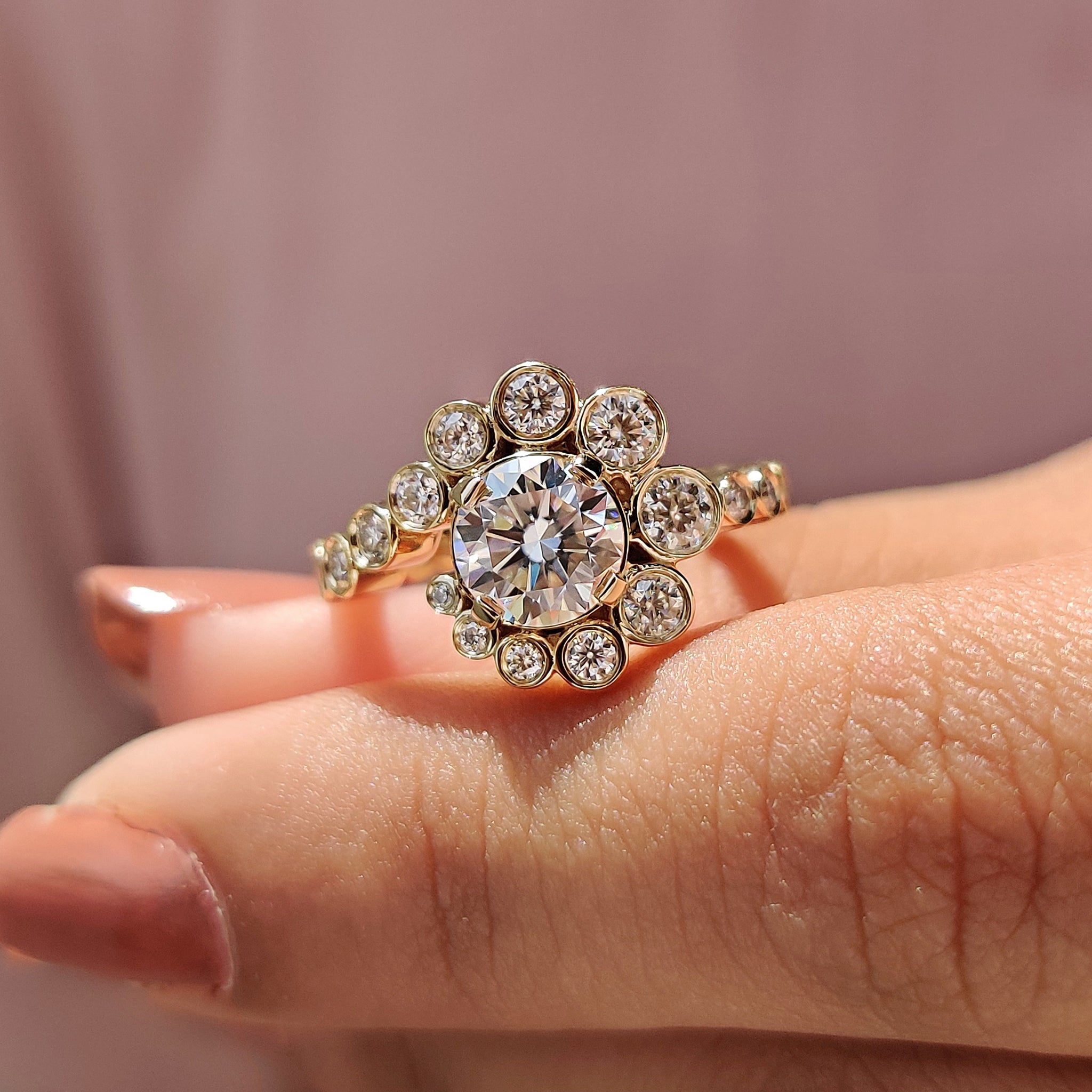 Moissanite engagement ring with a round cut and antique halo setting for timeless appeal.
