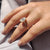 custom oval cut moissanite engagement ring with hidden halo and gold setting