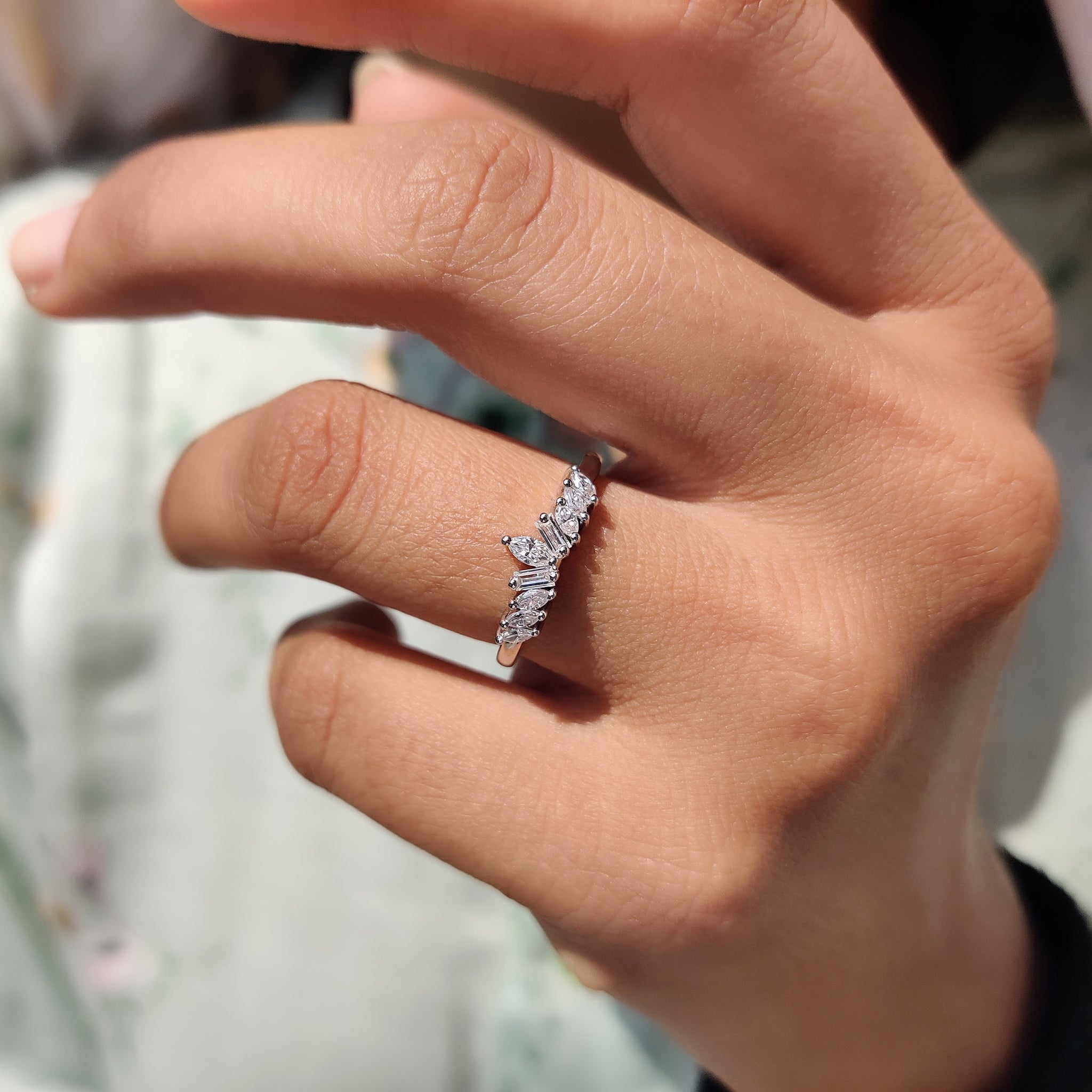 Delicate stackable wedding band ideal for layering with other rings or worn alone.