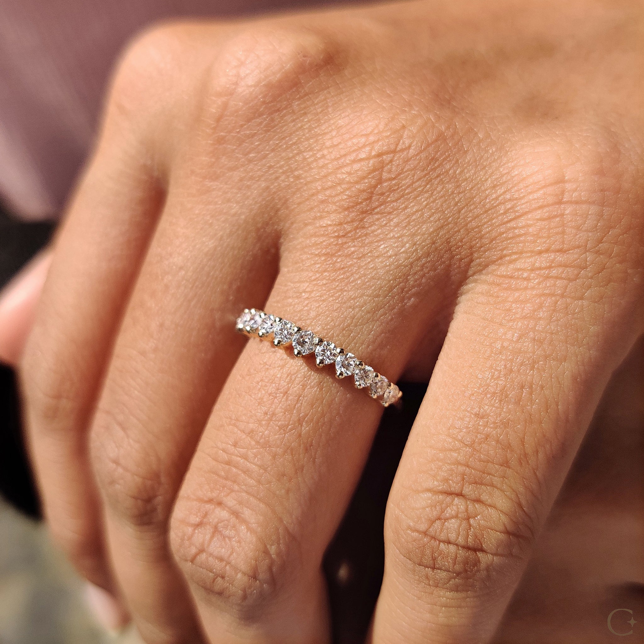 Carat Diamonds wedding band in yellow gold finish.
