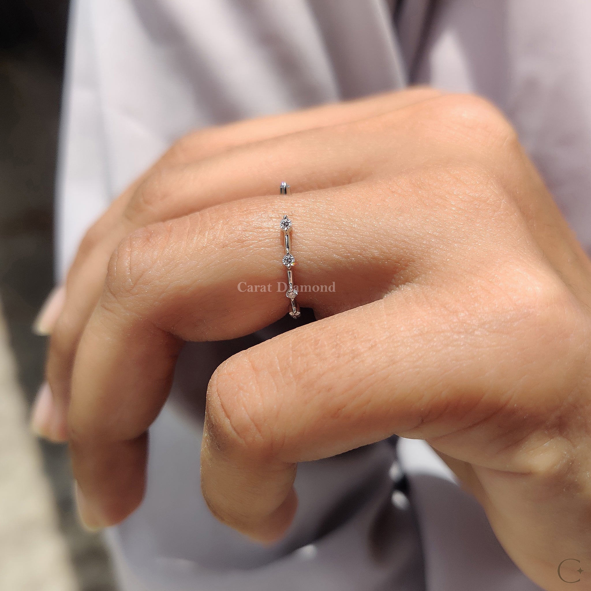 Carat Diamonds Wedding Band symbolizing love and timeless sophistication.