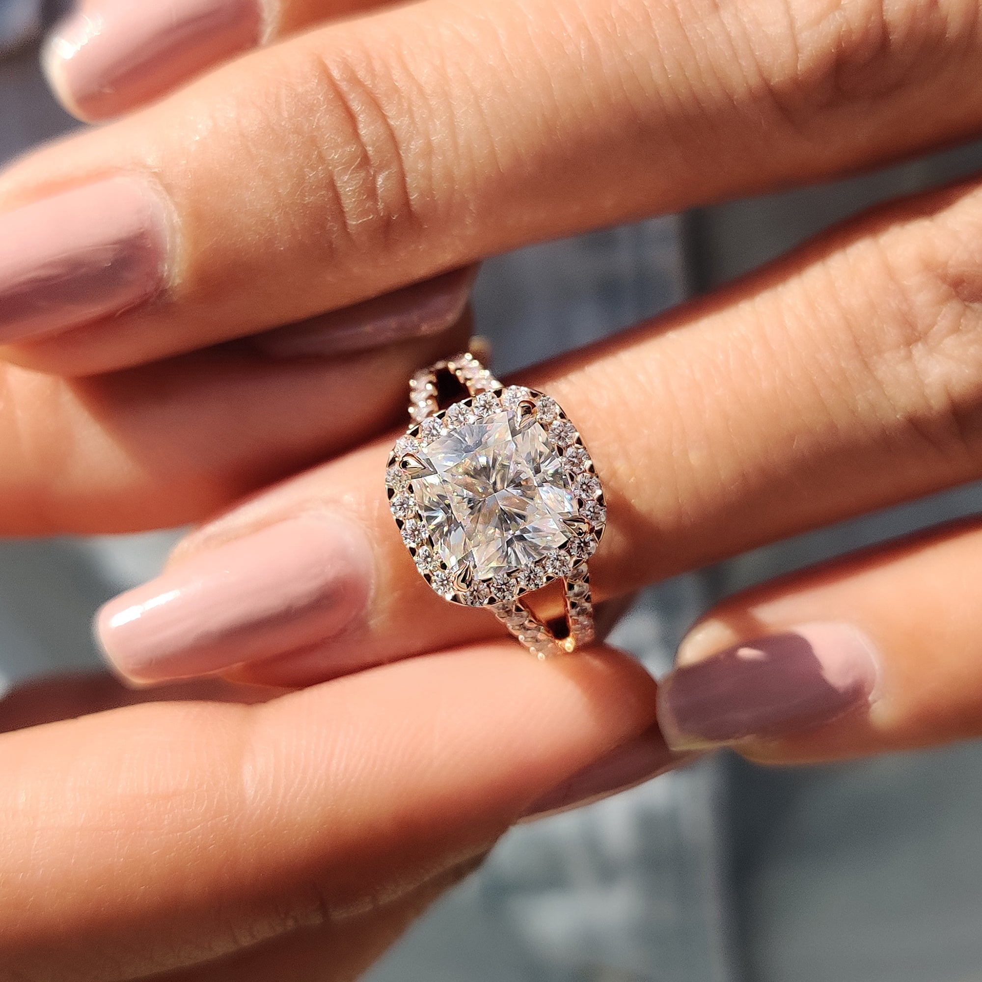 Proposal ring with a round cut and split pave band, handcrafted as a piece of bespoke handmade jewelry.
