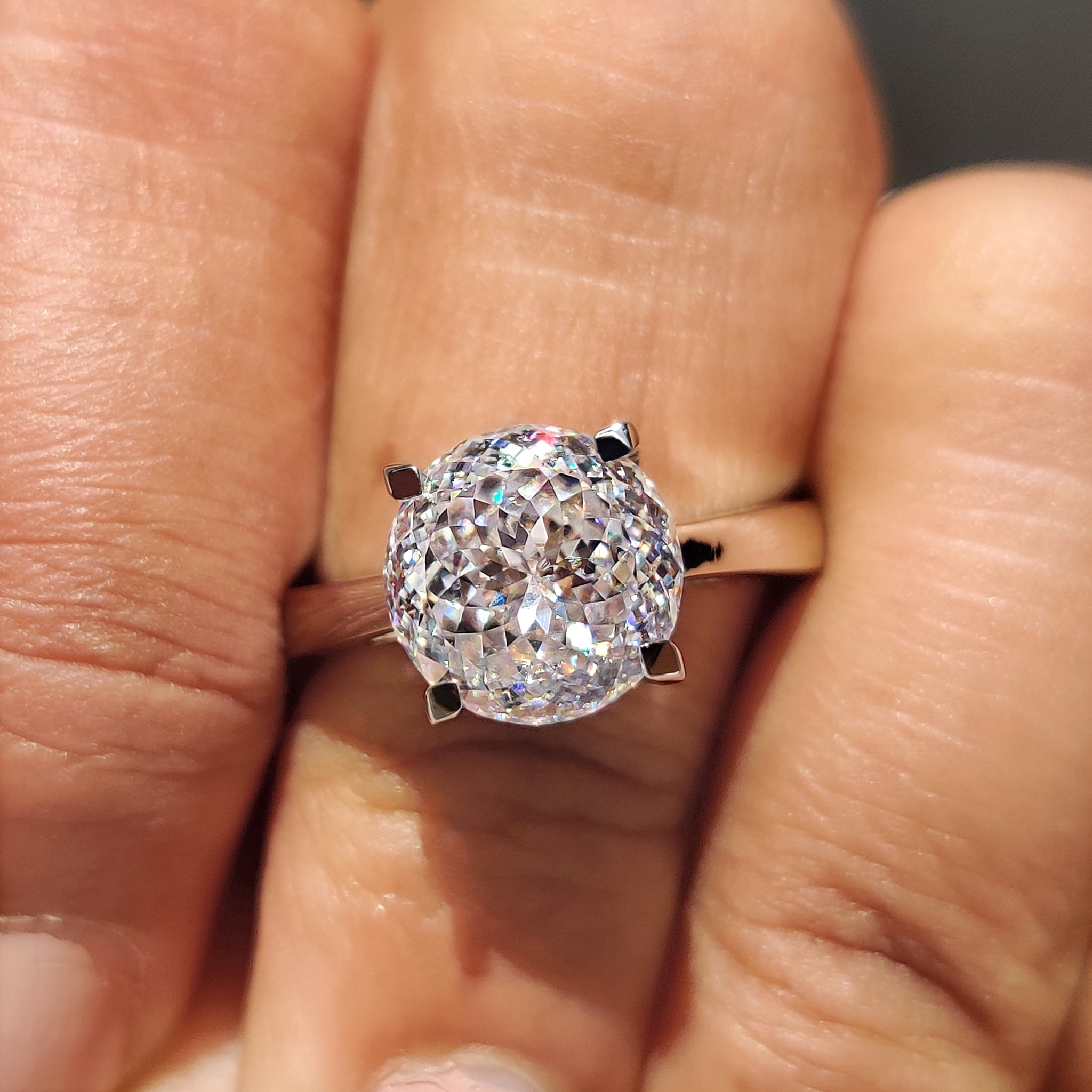Portuguese cut moissanite sparkles with unique bright style.