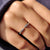 Round cut moissanite wedding band with an open front for comfort and visibility.
