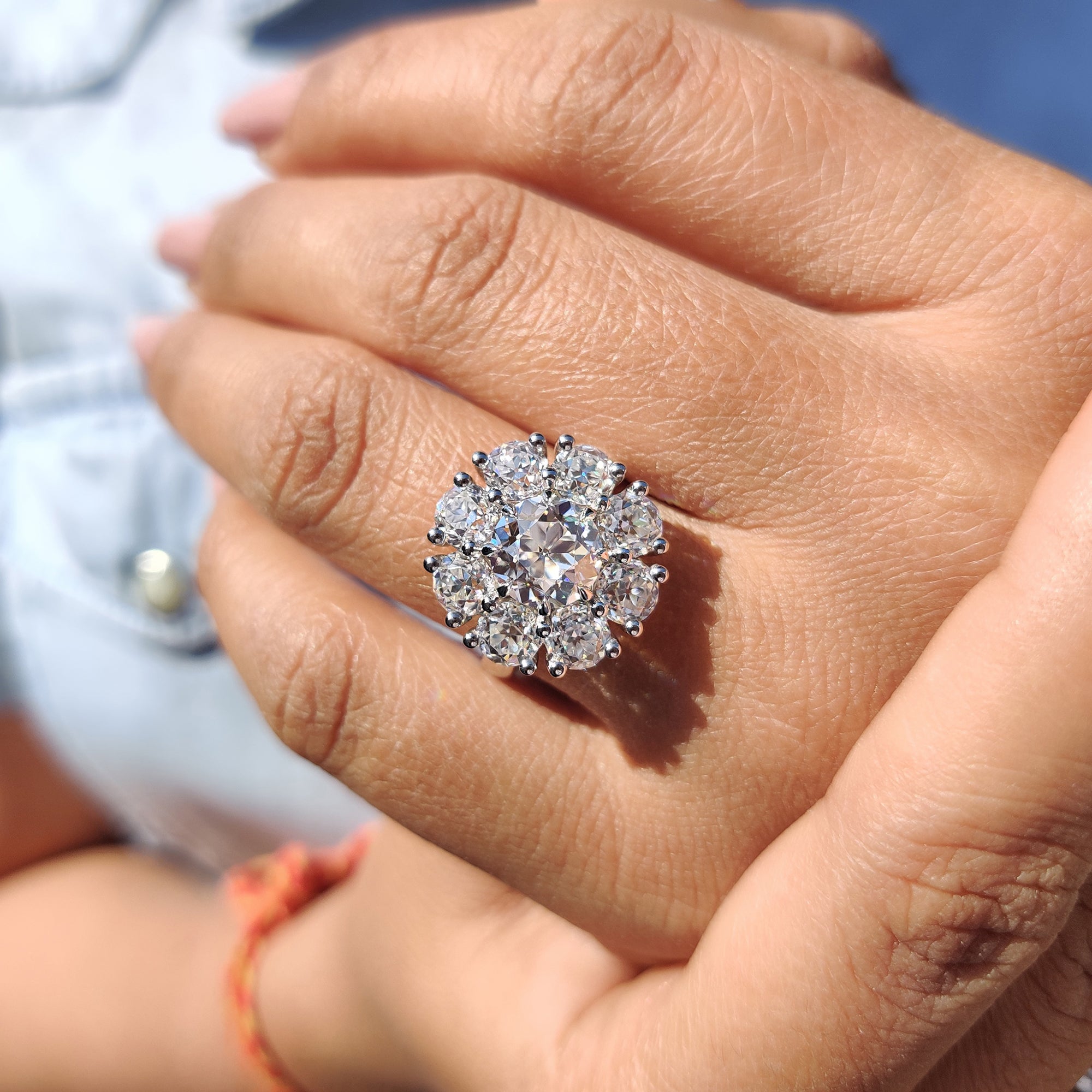 Custom halo cluster ring with Old European cut stone
