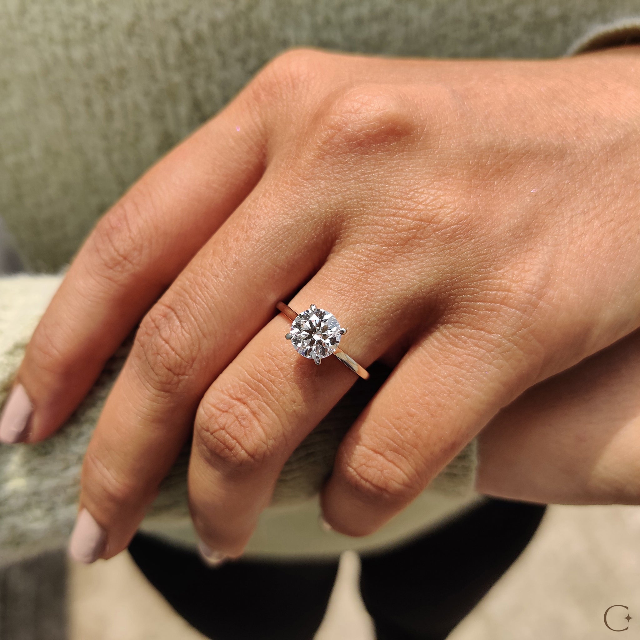 Elegant cathedral ring featuring a brilliant round diamond.
