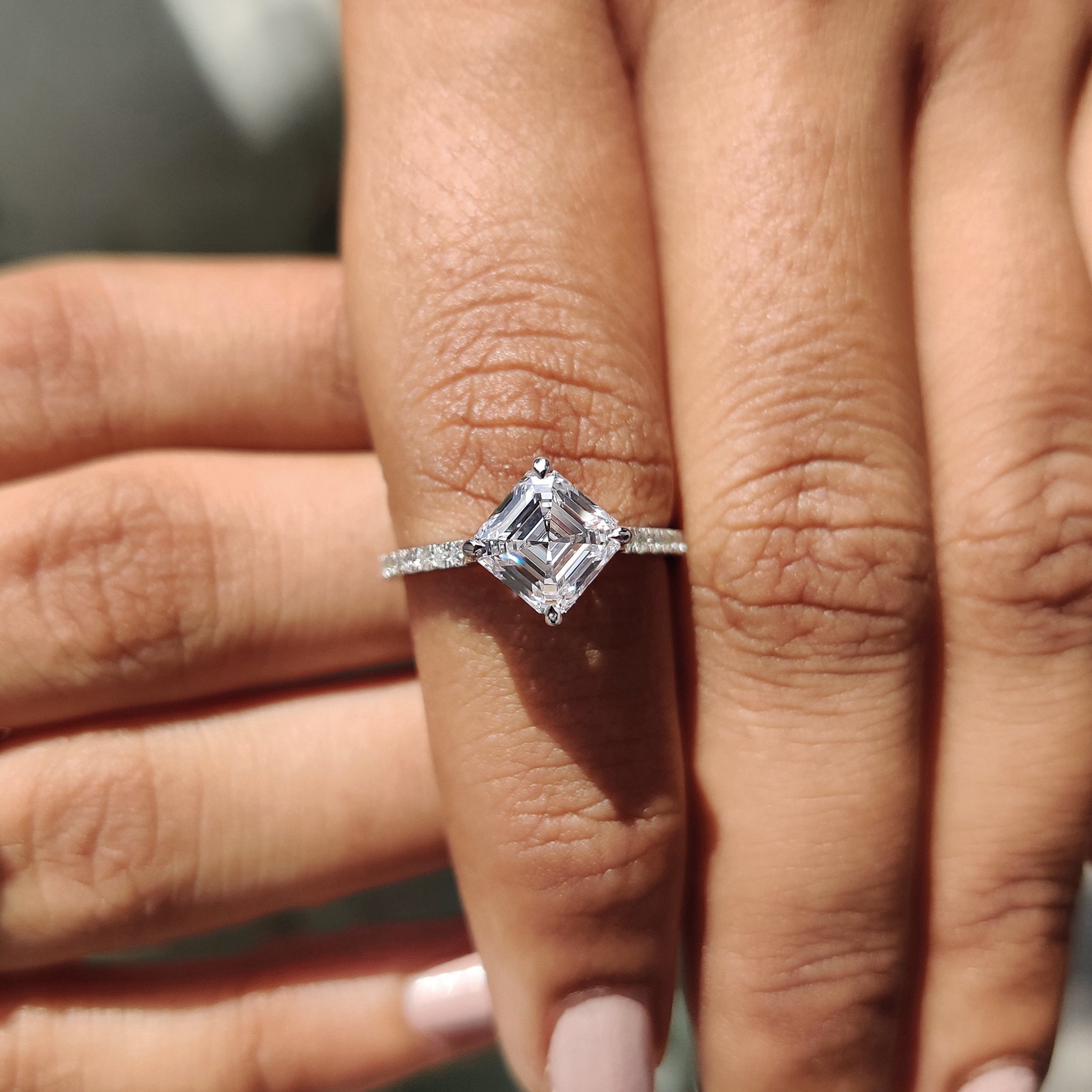 Asscher cut engagement ring with vintage-inspired elegance.
