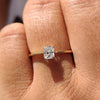Radiant cut gold engagement ring with a stunning diamond.
